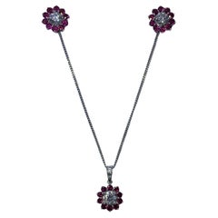 2.25ct Ruby and diamonds stud earrings and pendant necklace set in 18k gold.