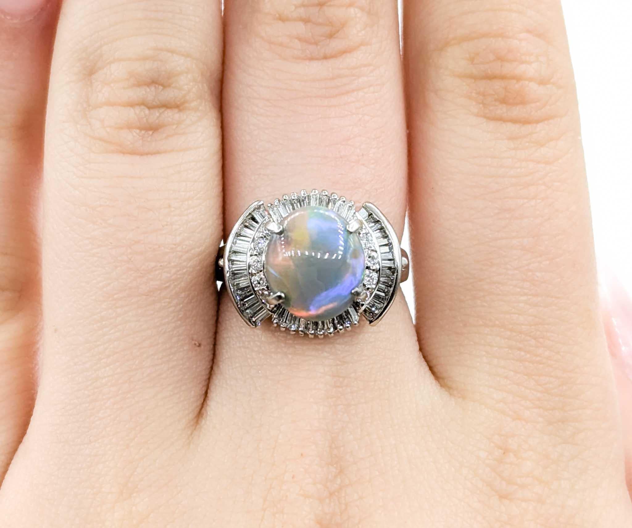 2.25ct Semi-Black Opal & Diamond Ballerina Ring in Platinum

Introducing this exquisite gemstone fashion ring crafted in 900 platinum. The ring features a dazzling 2.25ct opal complemented by 2.25ct diamonds. The sparkly diamonds are SI clarity with