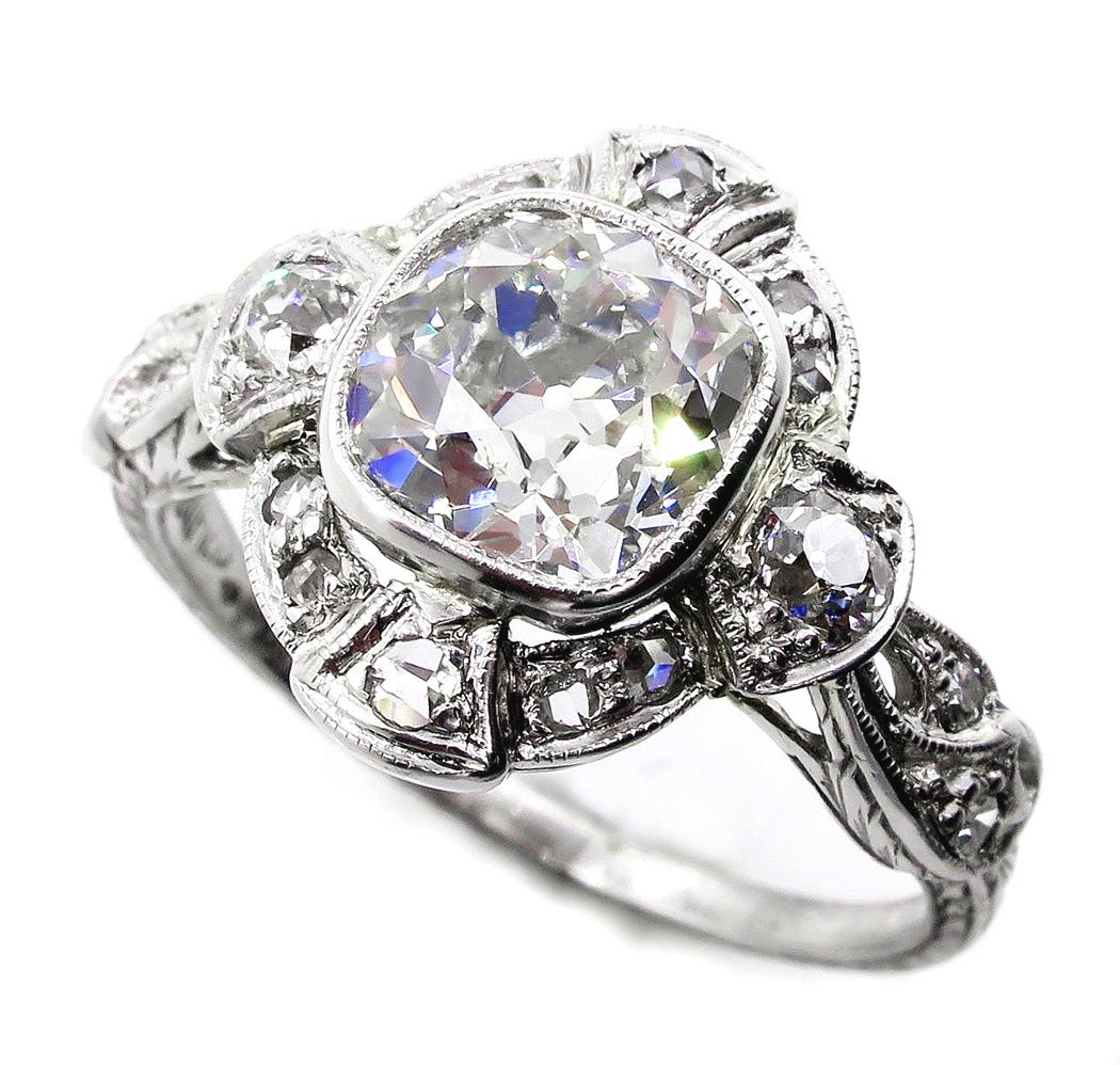 A sparkling antique cushion Mine-cut diamond is the crowning glory of this distinctive Edwardian ring, Circa 1910s, exquisitely hand-fabricated in platinum with the high standards expected of the early-twentieth century jeweler's craft.

A sizzling,