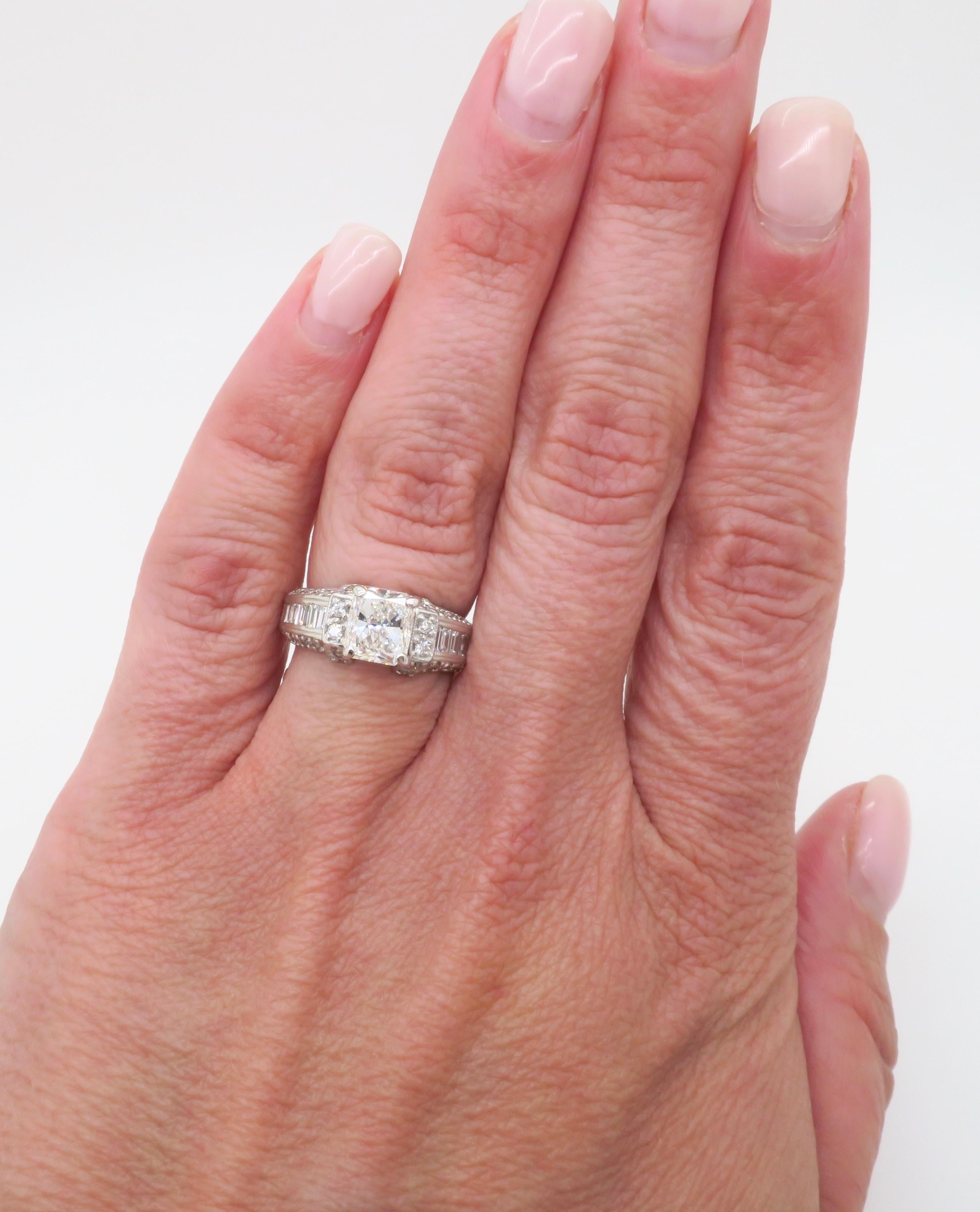 Beautiful IGI Certified Radiant cut diamond ring with 2.25CTW of diamonds. 

Center Diamond Carat Weight: 1.45CT 
Center Diamond Cut: Radiant
Center Diamond Color: G
Center Diamond Clarity: SI1
IGI Report: 3132660U
Accent Diamonds: Round Brilliant