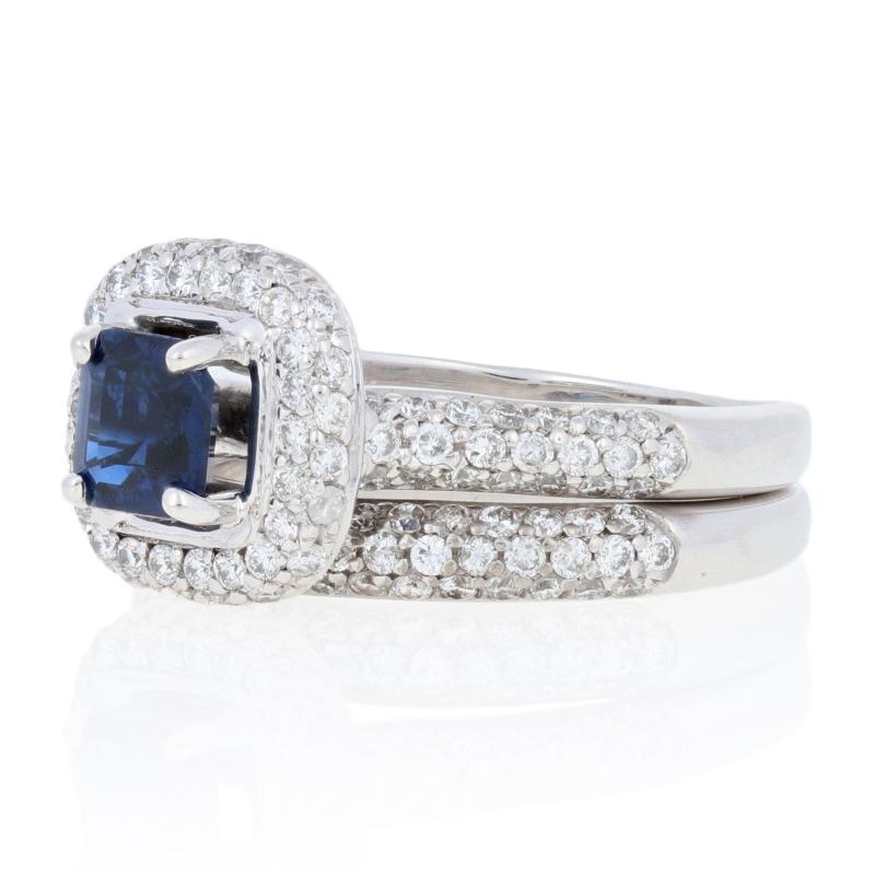 Celebrate your love story with this spectacular bridal set! Consisting of a romantic halo engagement ring and a matching wedding band, this 14k white gold set showcases a rich, silky blue sapphire accompanied by a glittering collection of icy white