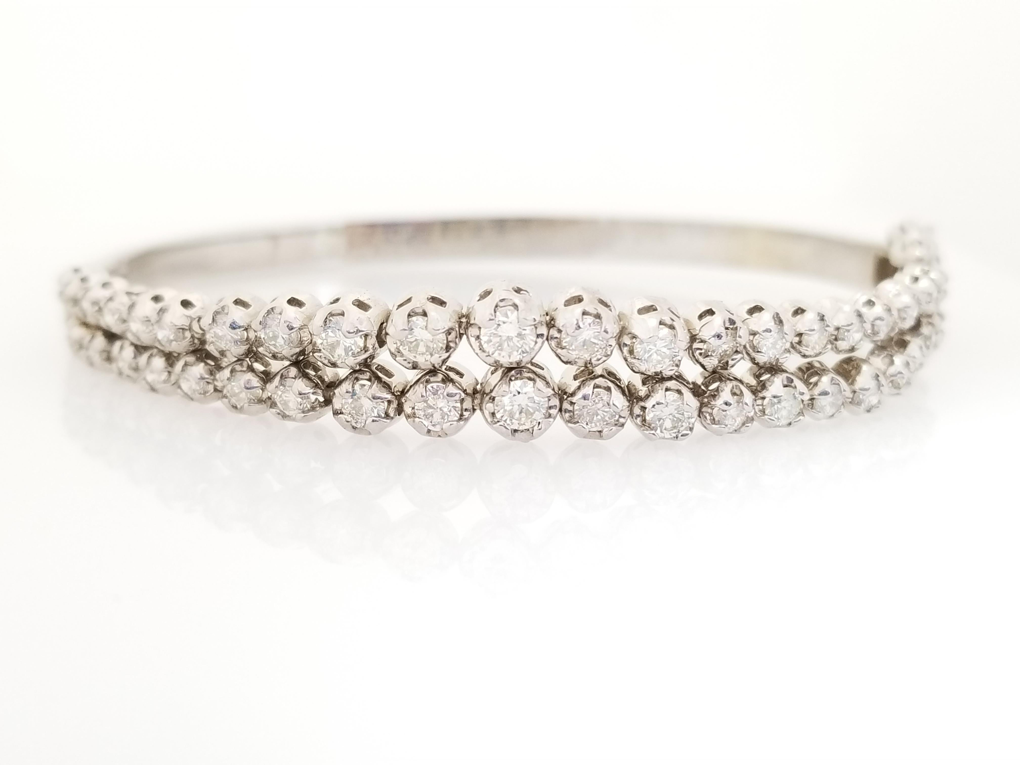 Bright and Shiny, Bold and Beautiful. Natural Diamonds double row graduated flexible bangle white gold 14k 7 Inch. Average Color I, Clarity VS.
