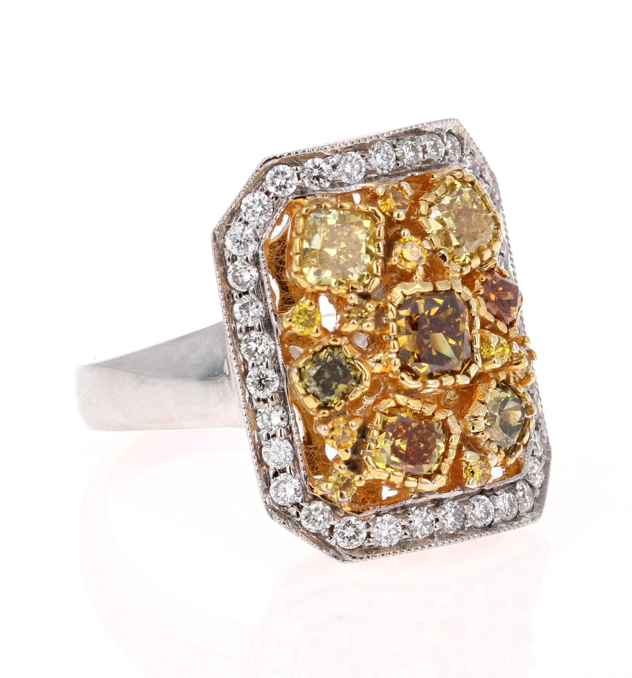 This magnificent beauty has Fancy Color Cushion Cut Natural Diamonds floating around the ring. The 7 Fancy Color Cushion Cuts weigh 1.66 Carats. It is embellished with 9 Yellow Round Cut Diamonds that weigh 0.11 Carats. It is further adorned with 34