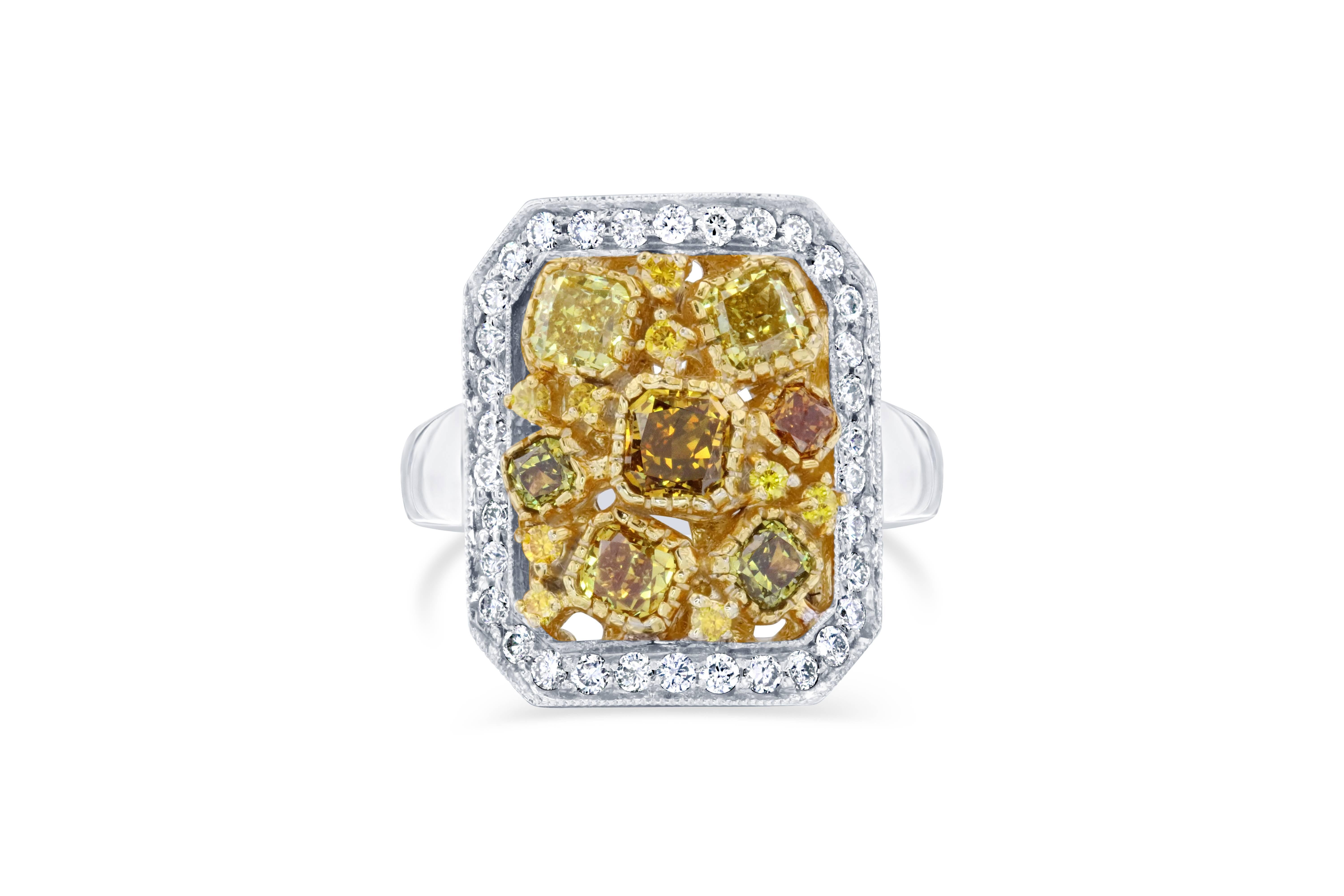 2.26 Carat Fancy Color Diamond 18 Karat White Gold Cocktail Ring

This magnificent beauty has Fancy Color Cushion Cut Natural Diamonds floating around the ring. The 7 Fancy Color Cushion Cuts weigh 1.72 Carats. It is embellished with 9 Yellow Round