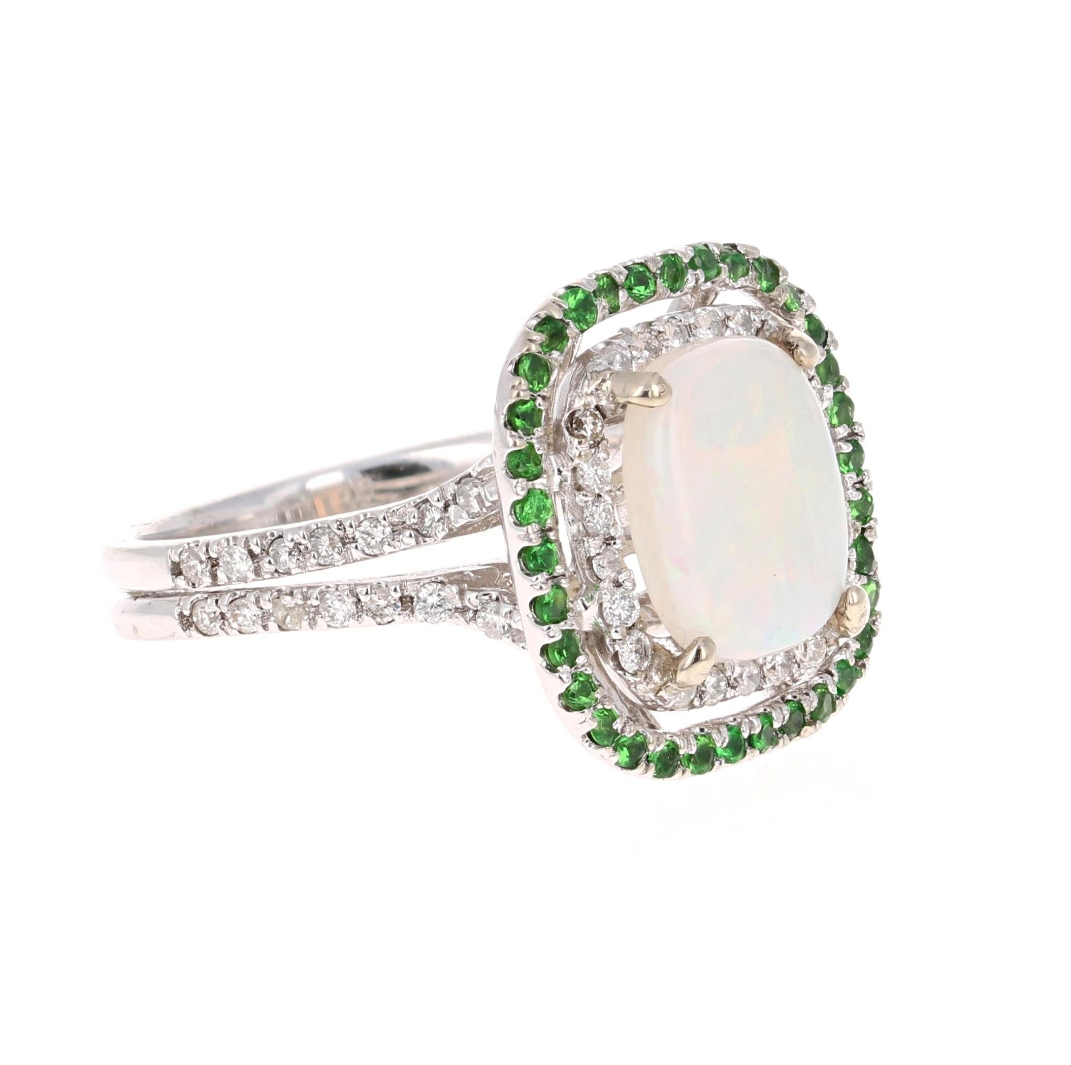 Stunning and uniquely designed 6.68 Carat Oval Cut Opal Diamond White Gold Ring with Tsavorite accents!

The Oval Cut Opal in the center of the ring weighs 1.58 Carats.  It is surrounded by 50 Round Cut Diamonds that weigh 0.35 Carats and 34