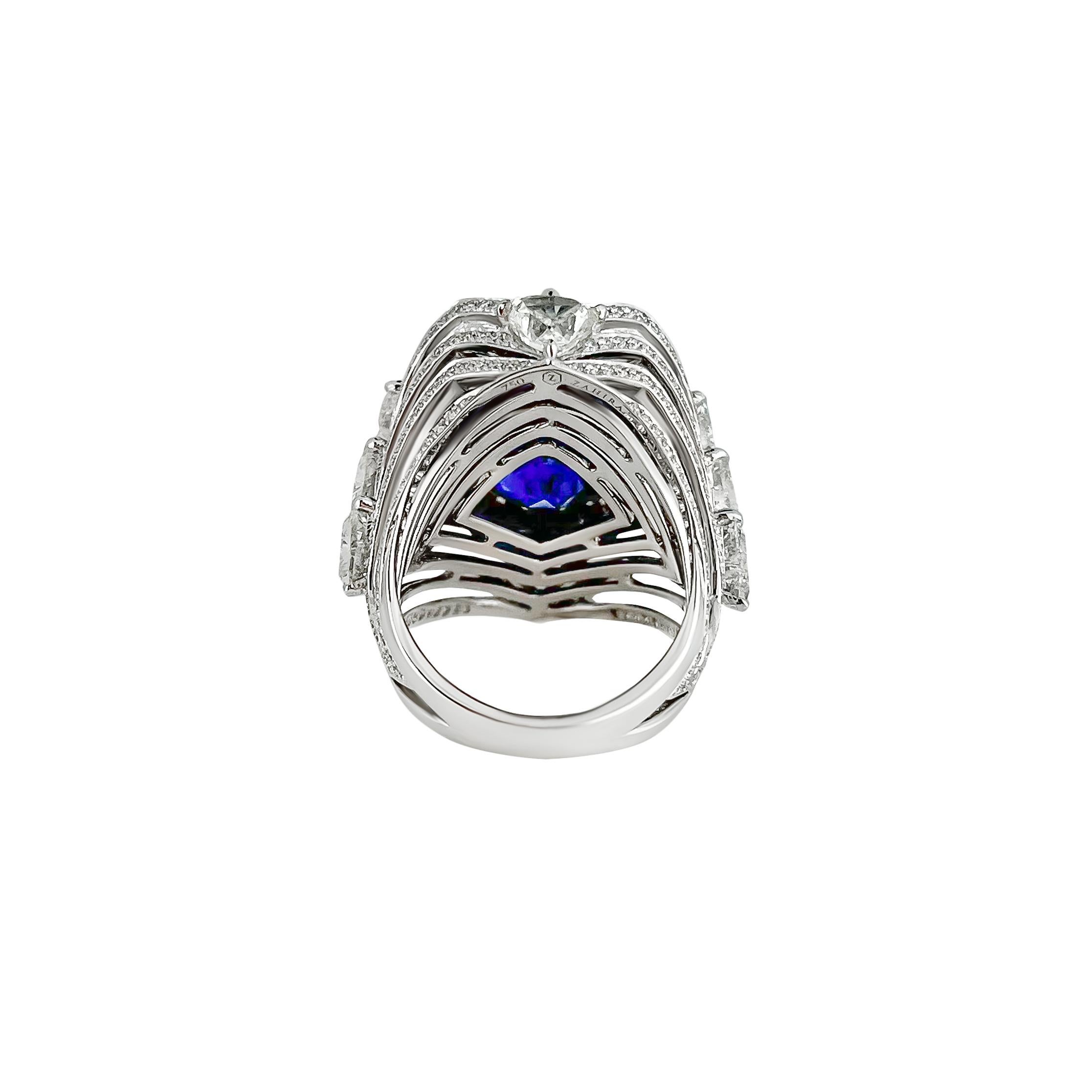 This incredibly rare 22.64 carat Royal Blue Ceylon Sapphire is destined to be a treasured heirloom. The vivid blue sapphire ring is adorned with nearly 5 carats of trillion cut diamonds and surround pave'd diamonds. This is a truly unique and show