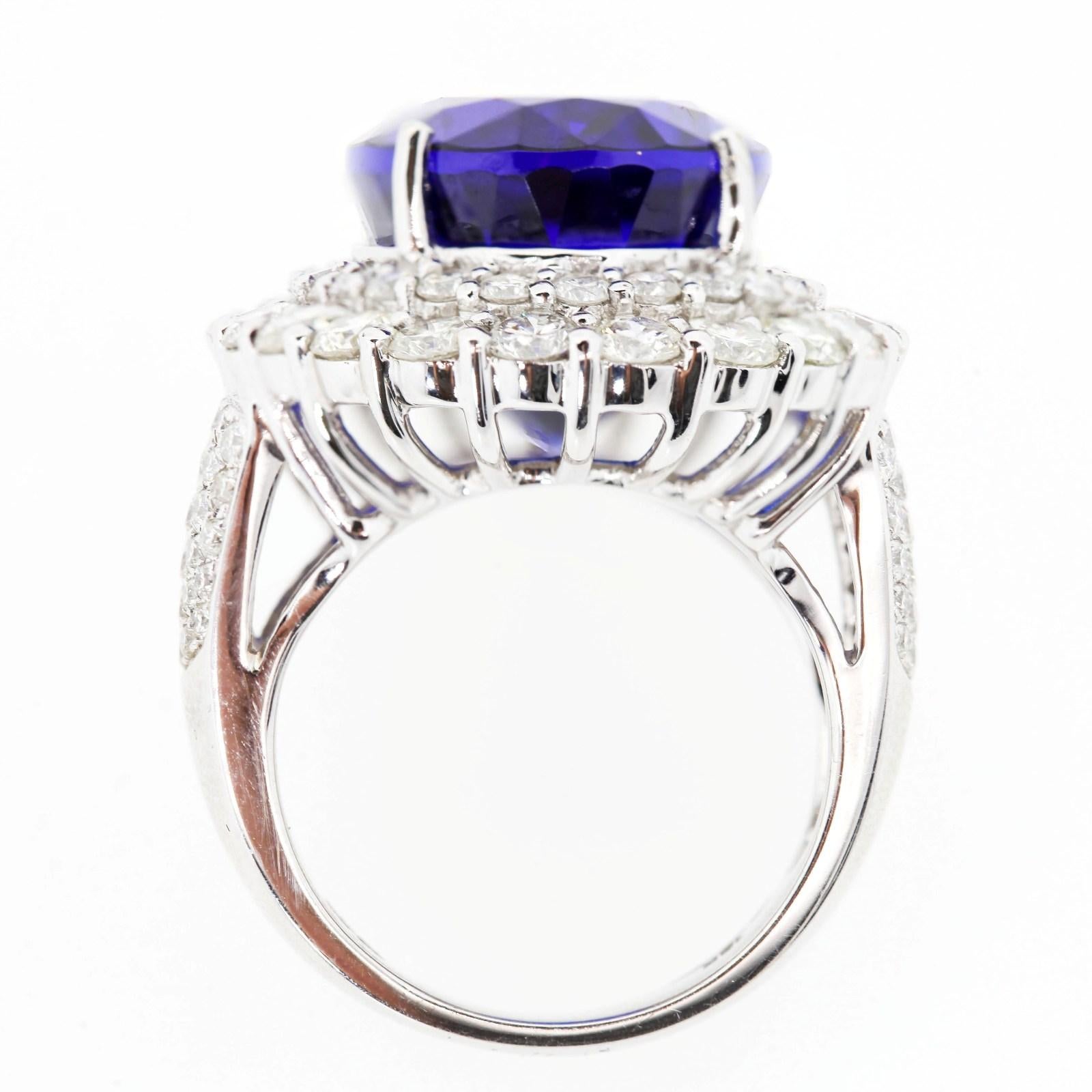 Oval Cut 22.68 Carat Tanzanite and Diamond Gold Ring For Sale