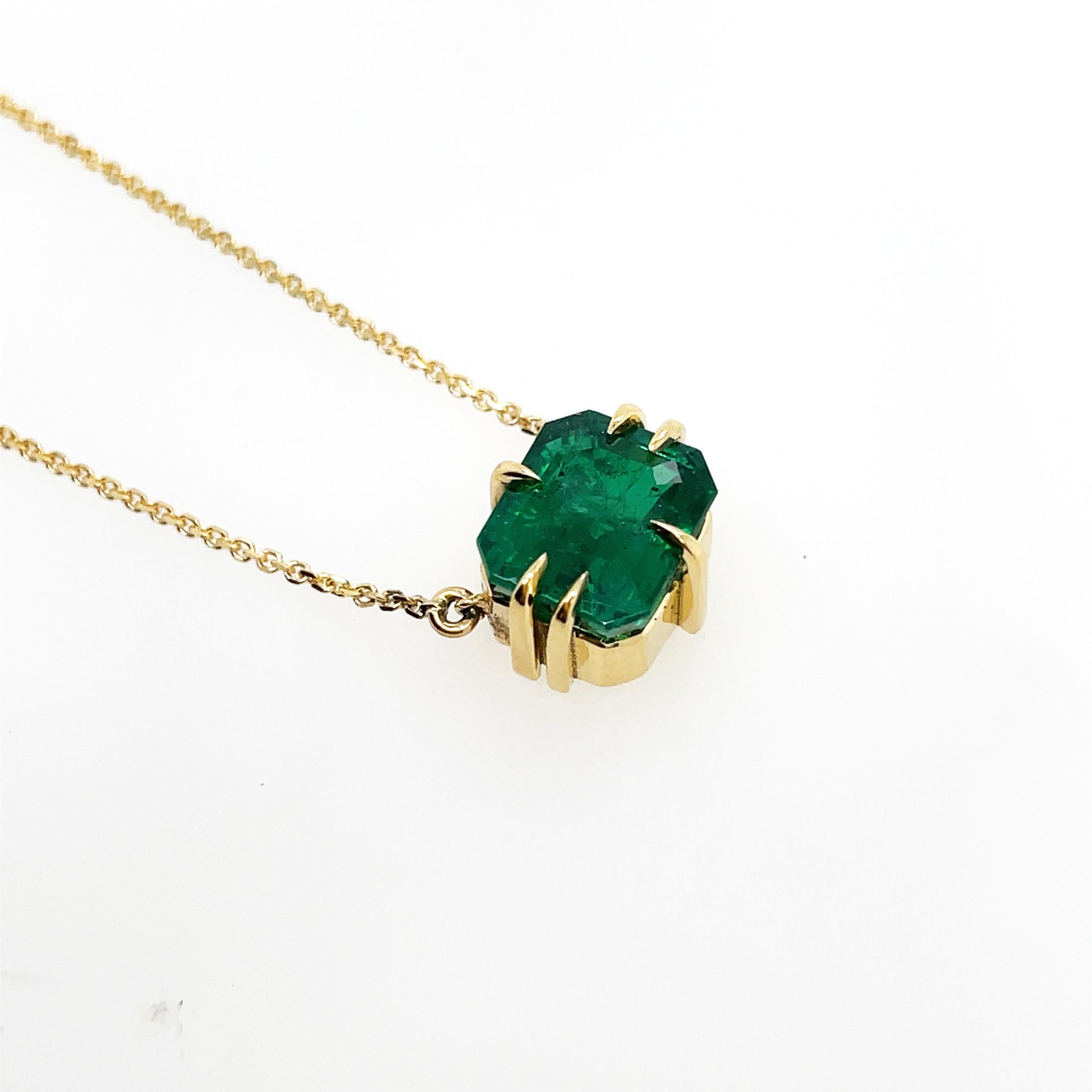 
2.26ct Lustrous forest green Emerald cut Emerald set in fierce claws in 18ct yellow gold with 42cm 18ct yellow gold chain.

Zambian emerald
Emerald cut
18k gold
42cm 18k chain
Ohliguer signature claws
Ready to ship in gift box
Comes with