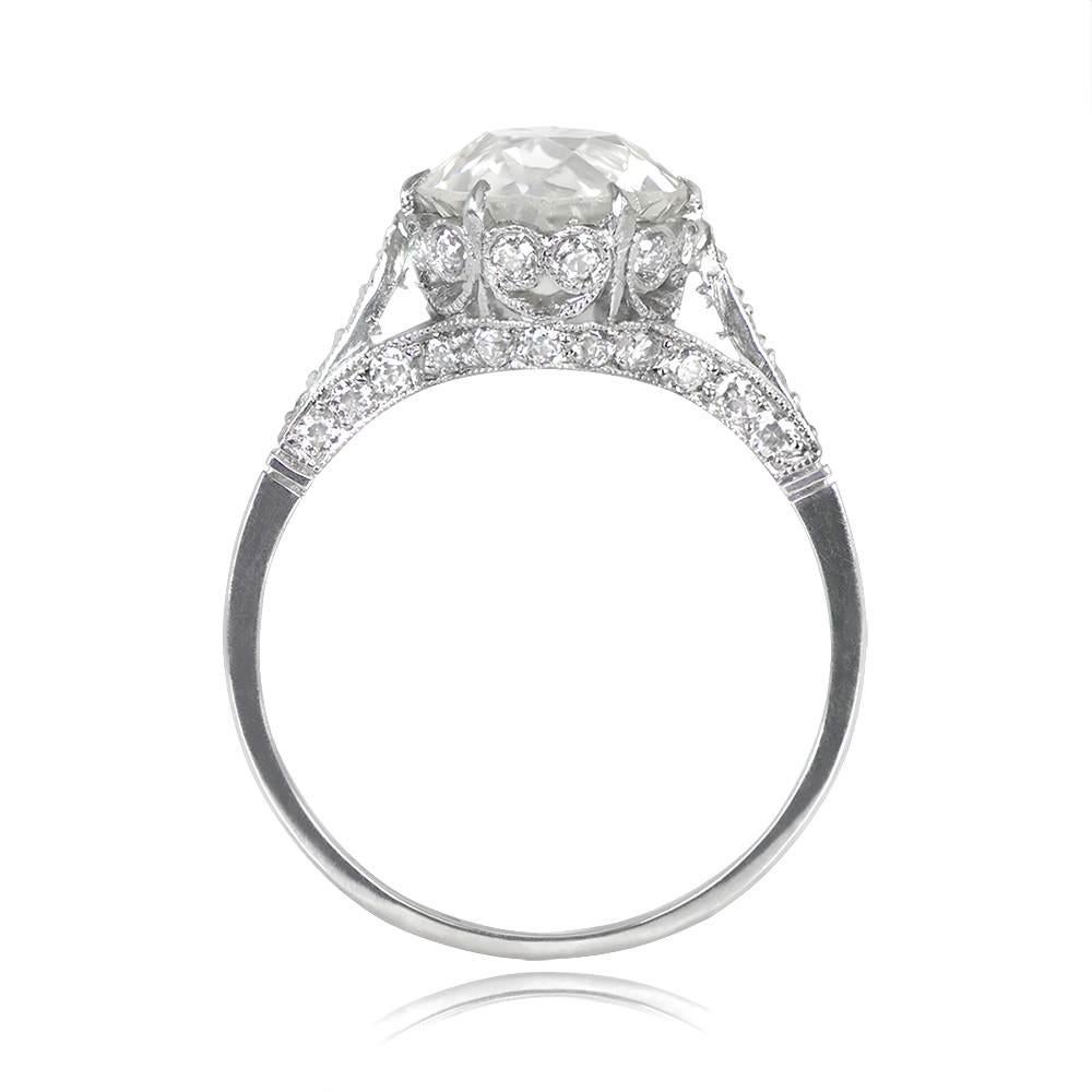 Behold a breathtaking platinum ring adorned with a dazzling old European cut diamond, weighing 2.26 carats, boasting a K color grade and SI2 clarity. The shoulders of this exquisite piece are elegantly accentuated by smaller old European cut