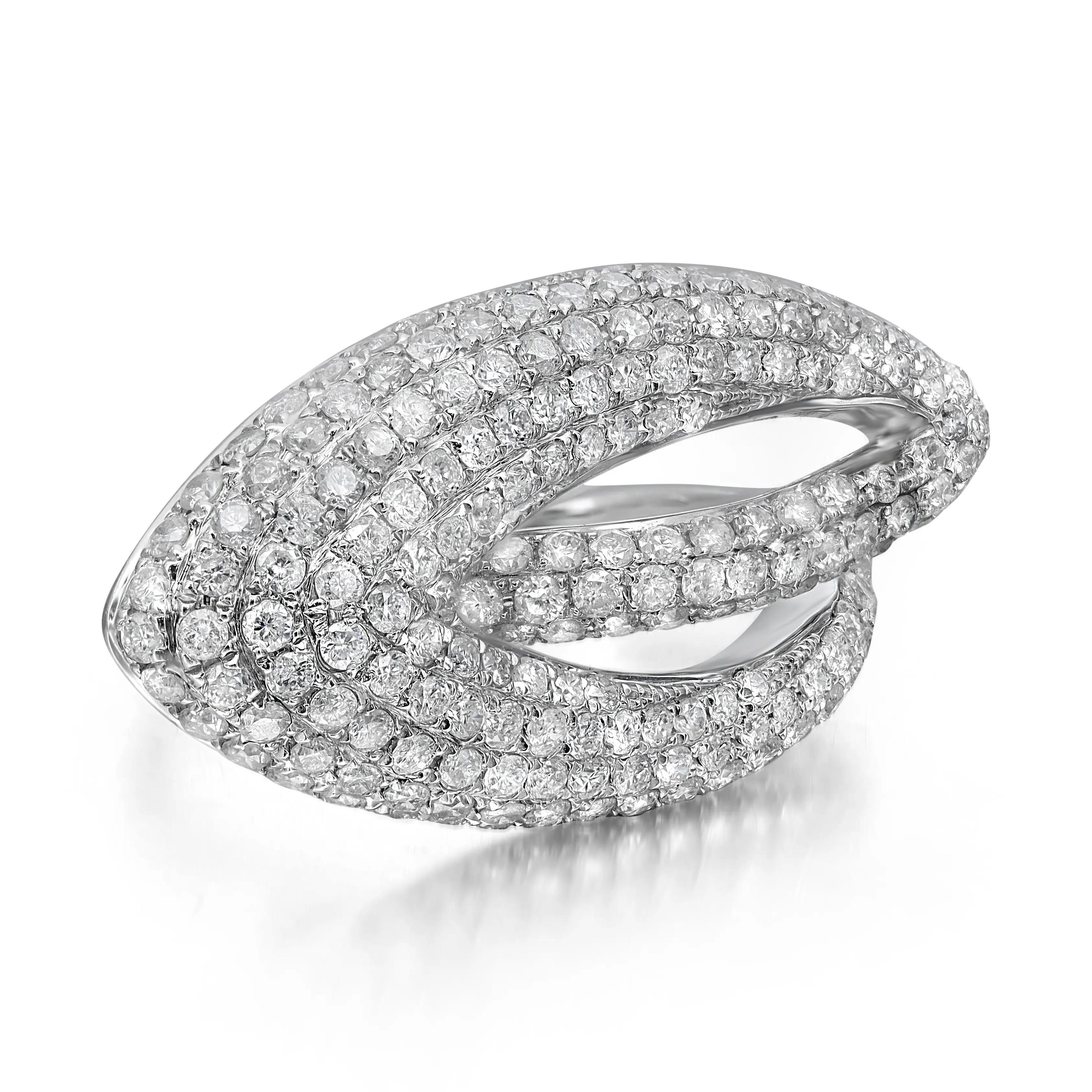 Stylish and elegant diamond cocktail ring rendered in highly polished 14K white gold. This ring features sparkling round cut diamonds in pave setting totaling 2.26 carats. Diamond quality: H - I color and SI1 clarity. Ring size: 7.5. Total weight: 6
