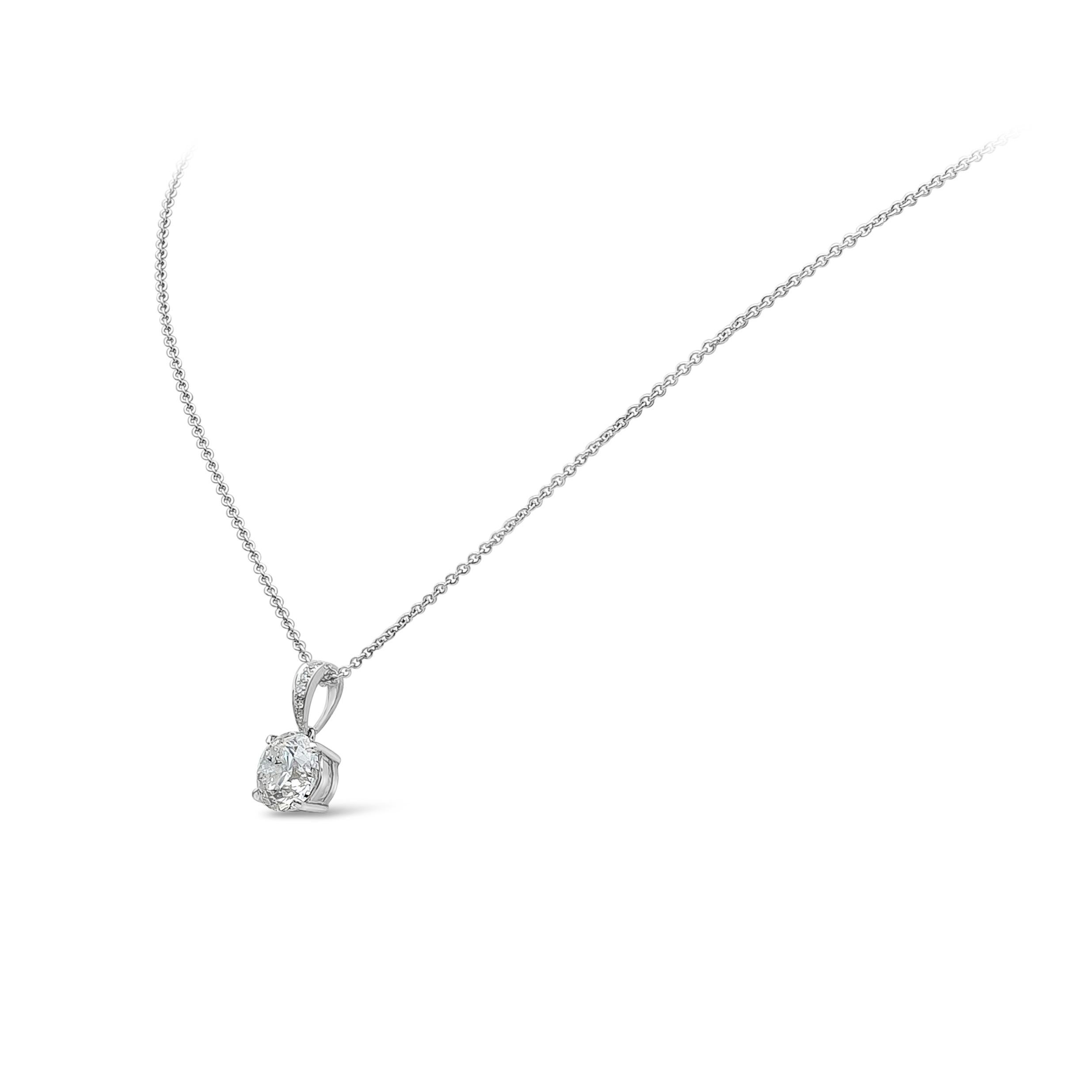 A classic and simple solitaire pendant necklace showcasing a 2.27 carat total, F Color and I1 in Clarity. Suspended on a diamond encrusted bail weighing 0.07 carats, F Color and VS-Si in Clarity. 
Set in a timeless 4 prong setting, Made with 18K