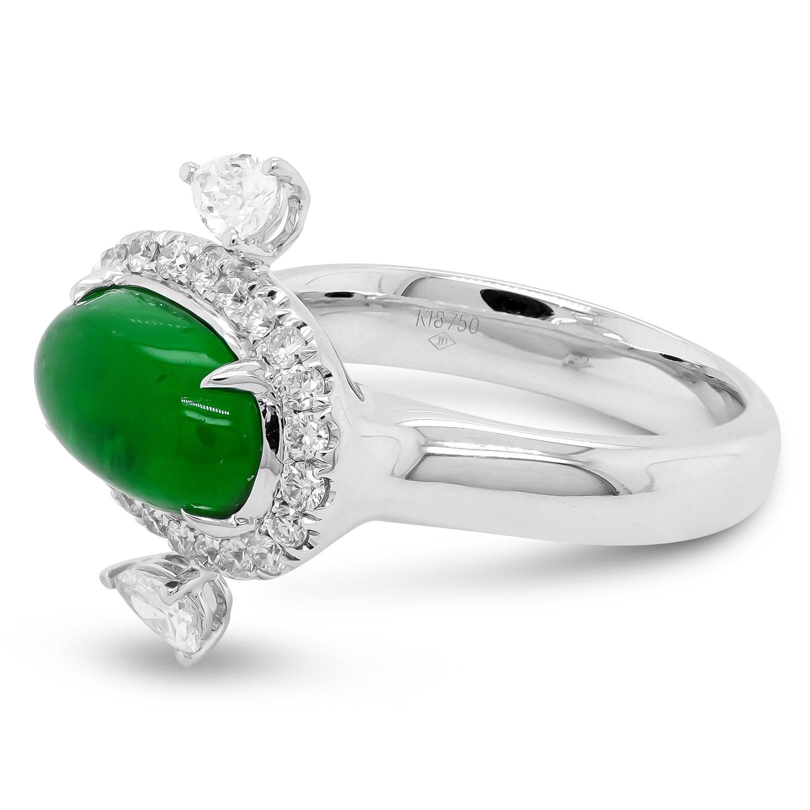 A beautiful Jade like Colombian emerald is set along with 0.58 carats of white diamond using 18k white gold. The ring is perfect for red carpet events. To find such translucent emerald cabochon is rare and the ring design does justice to the natural