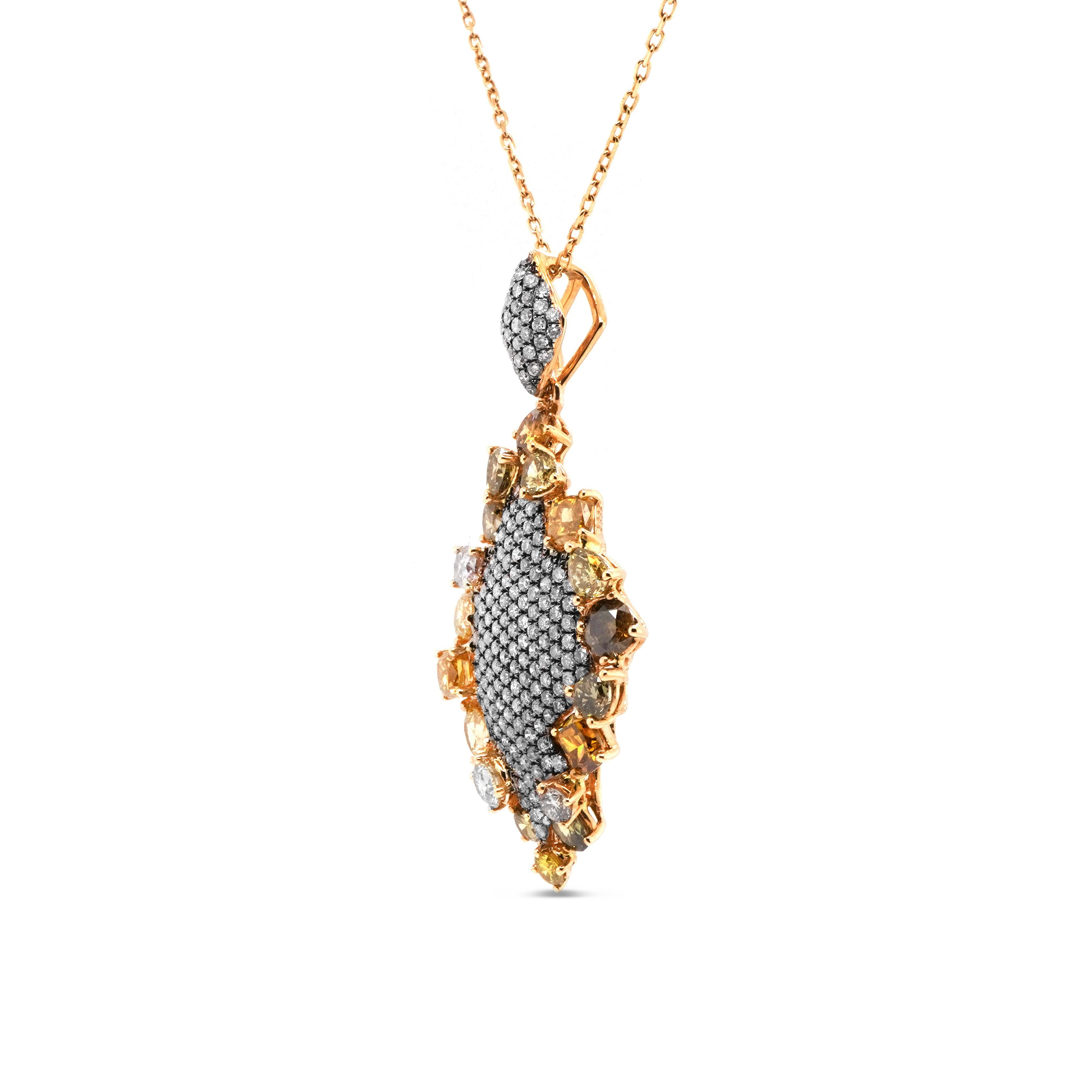 A beautiful combination of 2.27 carat fancy color diamond and 0.67 carat natural fancy pink diamond are put together to form this one of a kind pendant. Its a mix of Yellow, Orange, green and Pink fancy color diamonds. 
