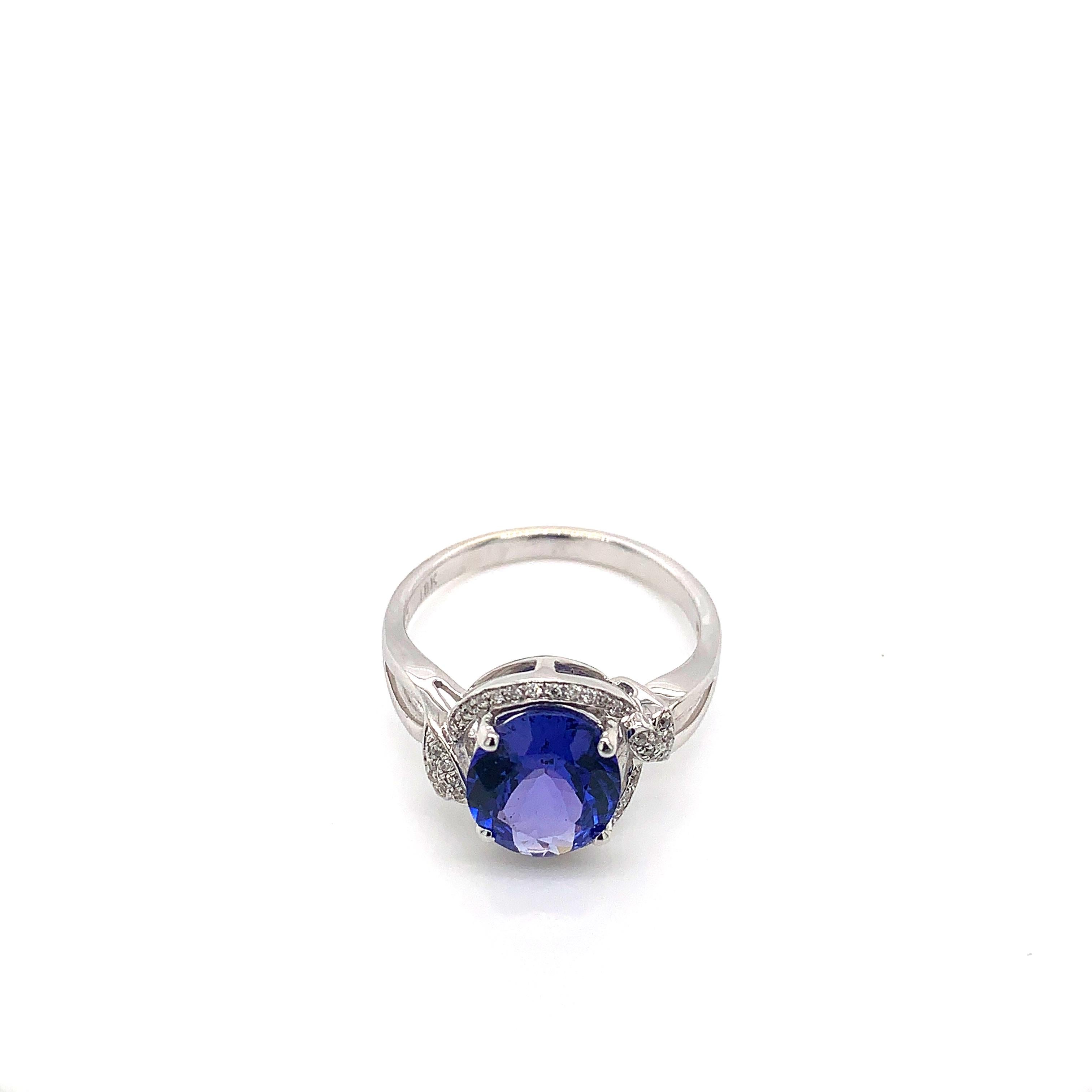 Classic tanzanite ring in 18K white gold with diamonds. 

Tanzanite: 2.270 carat oval shape.
Diamonds: 0.13 carat, G colour, VS clarity. 
Gold: 3.52g, 18K white gold. 