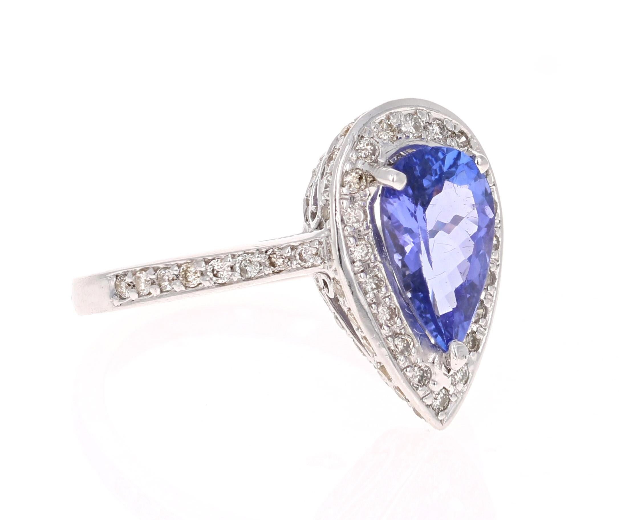 This ring has a gorgeous Pear Cut Tanzanite that weighs 1.67 Carats. It is surrounded by 97 Round Cut Diamonds that weigh 0.60 Carats. 

Elegantly set in 18 Karat White Gold and weighs approximately 5.4 grams 

The ring is a size 6 3/4 and can be