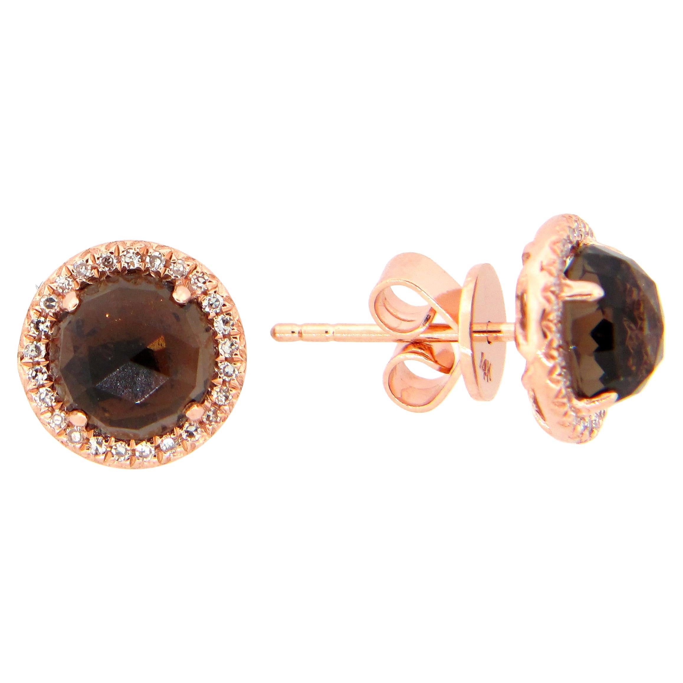 These Smokey Quartz & Diamond Earrings are a stunning and timeless accessory that can add a touch of glamour and sophistication to any outfit. 

These earrings each feature a 1.14 Carat Round Smokey Quartz, with a Diamond Halo comprised of 0.06