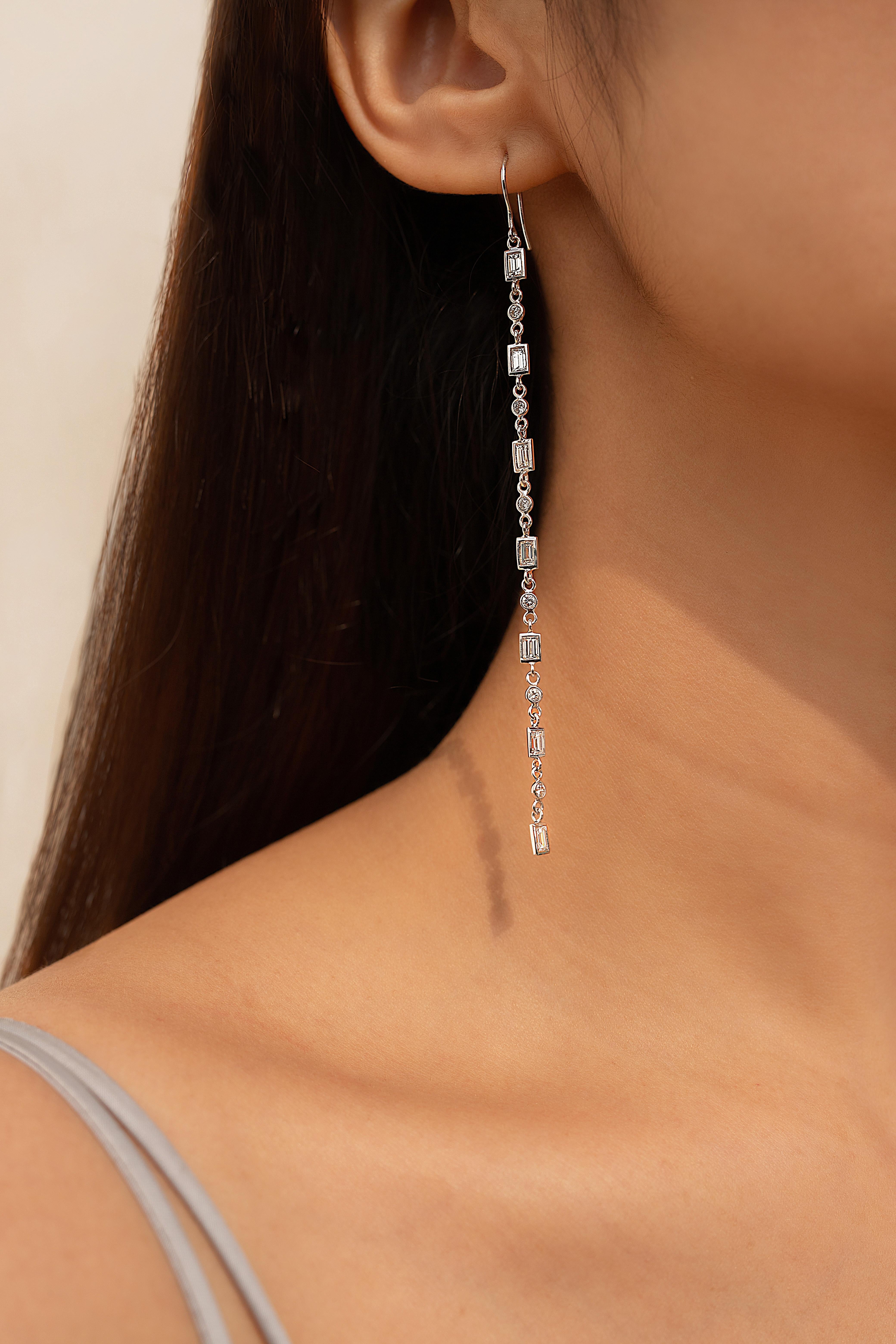 18K White Gold Shoulder Dust Diamond Dangle earrings to make a statement with your look. These earrings create a sparkling, luxurious look featuring octagon and round cut diamonds.
If you love to gravitate towards unique styles, this piece of