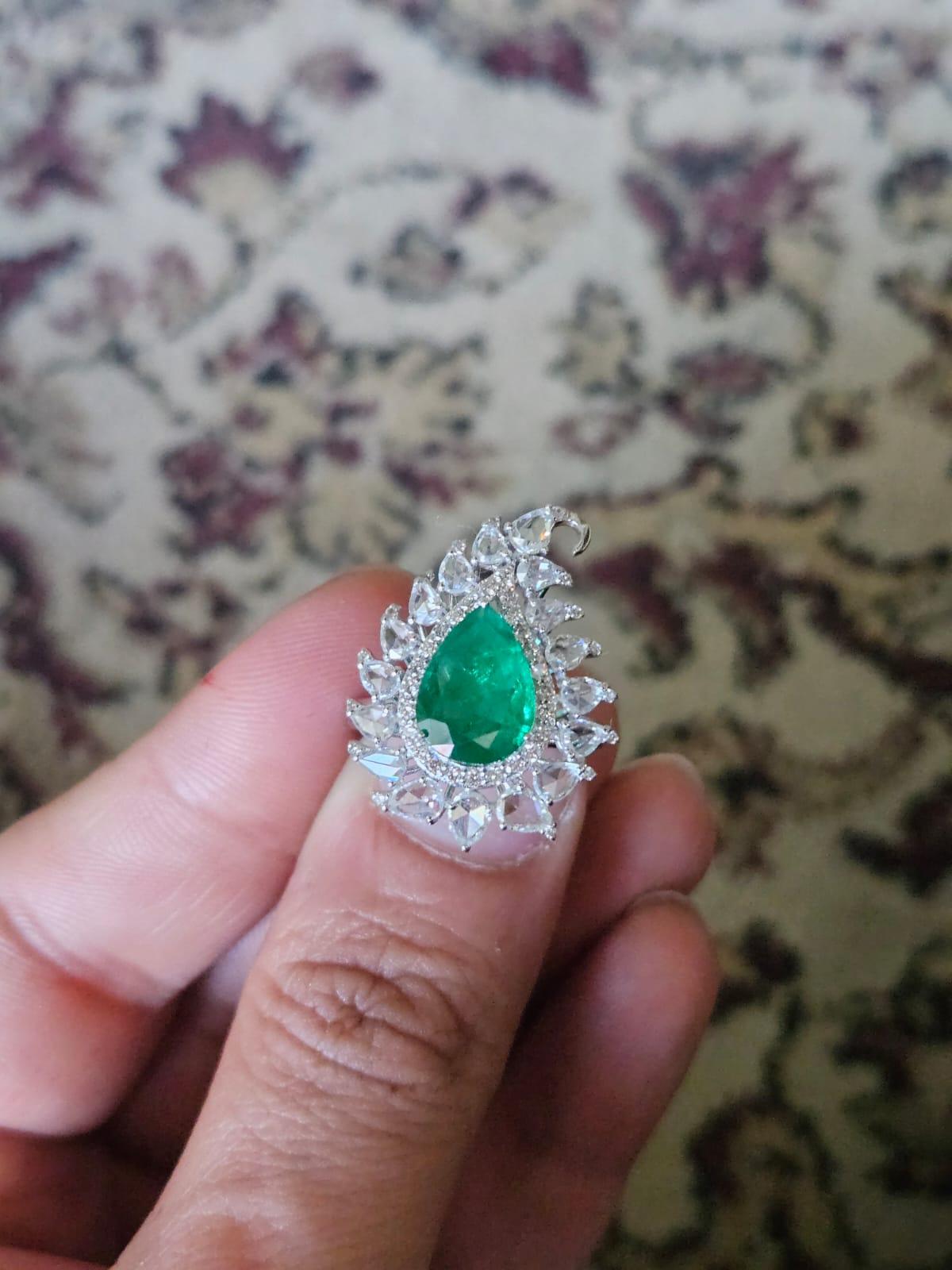 A very gorgeous and beautiful, one of a kind, Emerald Cocktail Ring set in 18K White Gold & Diamonds. The weight of the pear shaped Emerald is 2.27 carats. The Emerald is completely natural, without any treatment and is of Zambian origin. The