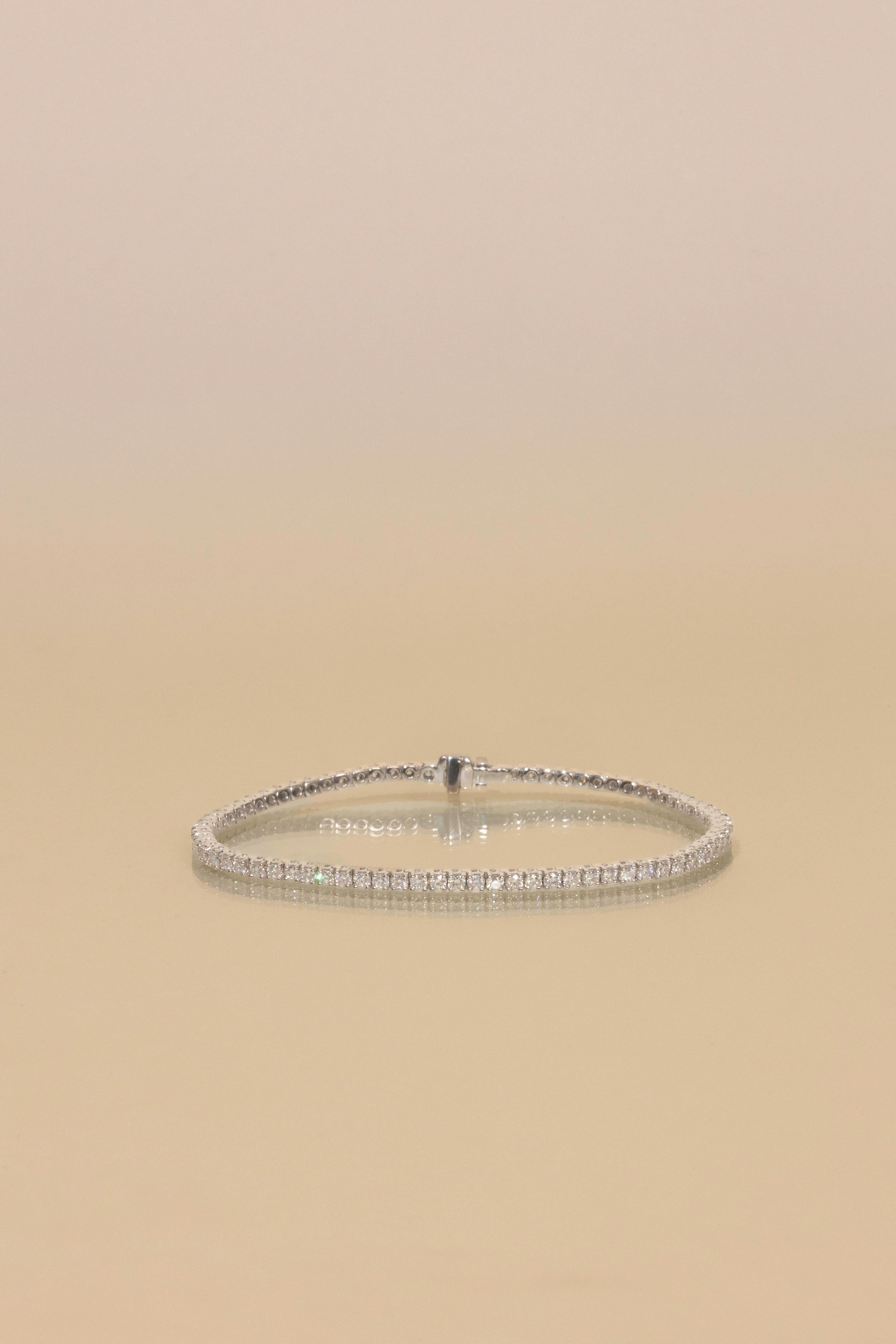 This 2.27 ct Tennis Bracelet is a timeless piece that exudes sophistication and elegance. Crafted in pristine white gold, the bracelet features meticulously selected FG VS diamonds, known for their exceptional clarity and brilliance. Each diamond,