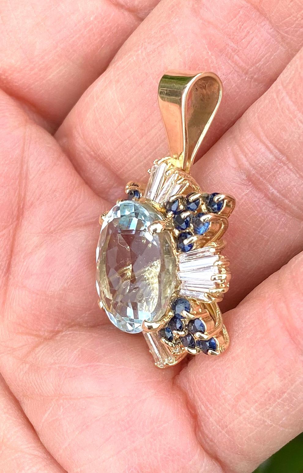 Contemporary 22.70 TCW Sapphire and Diamond Baguette Pendant with Oval Blue Topaz 14 Karat  For Sale