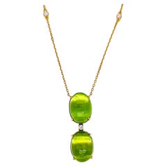 Collana in oro giallo con diamante rotondo e peridoto da 22,71 carati
