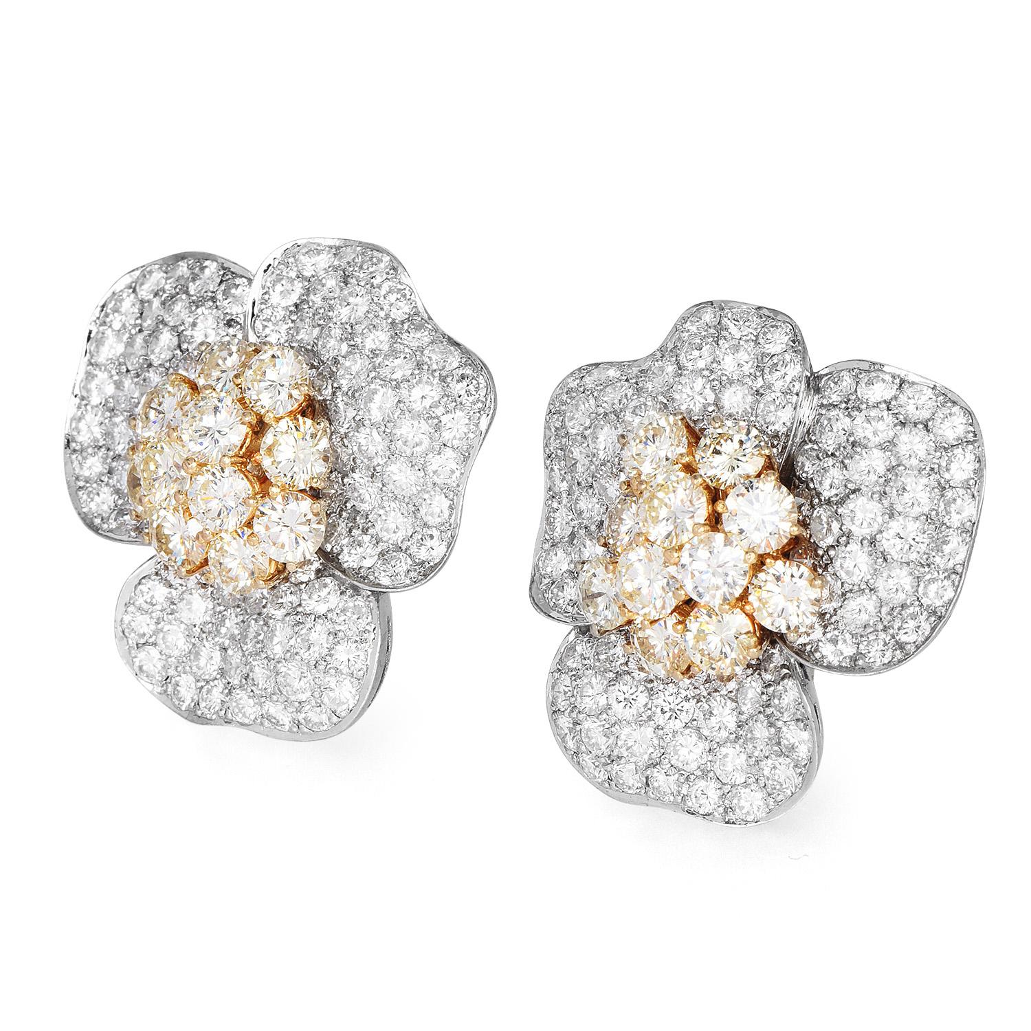 Create a Majestic look with these stunning earrings!

These Stylish 18K Two-Toned Gold Pave Diamond Earrings were

inspired by a Large Flower motif.

Bright white & yellow Pave set Diamonds mounted in white & yellow gold adorn the center of the