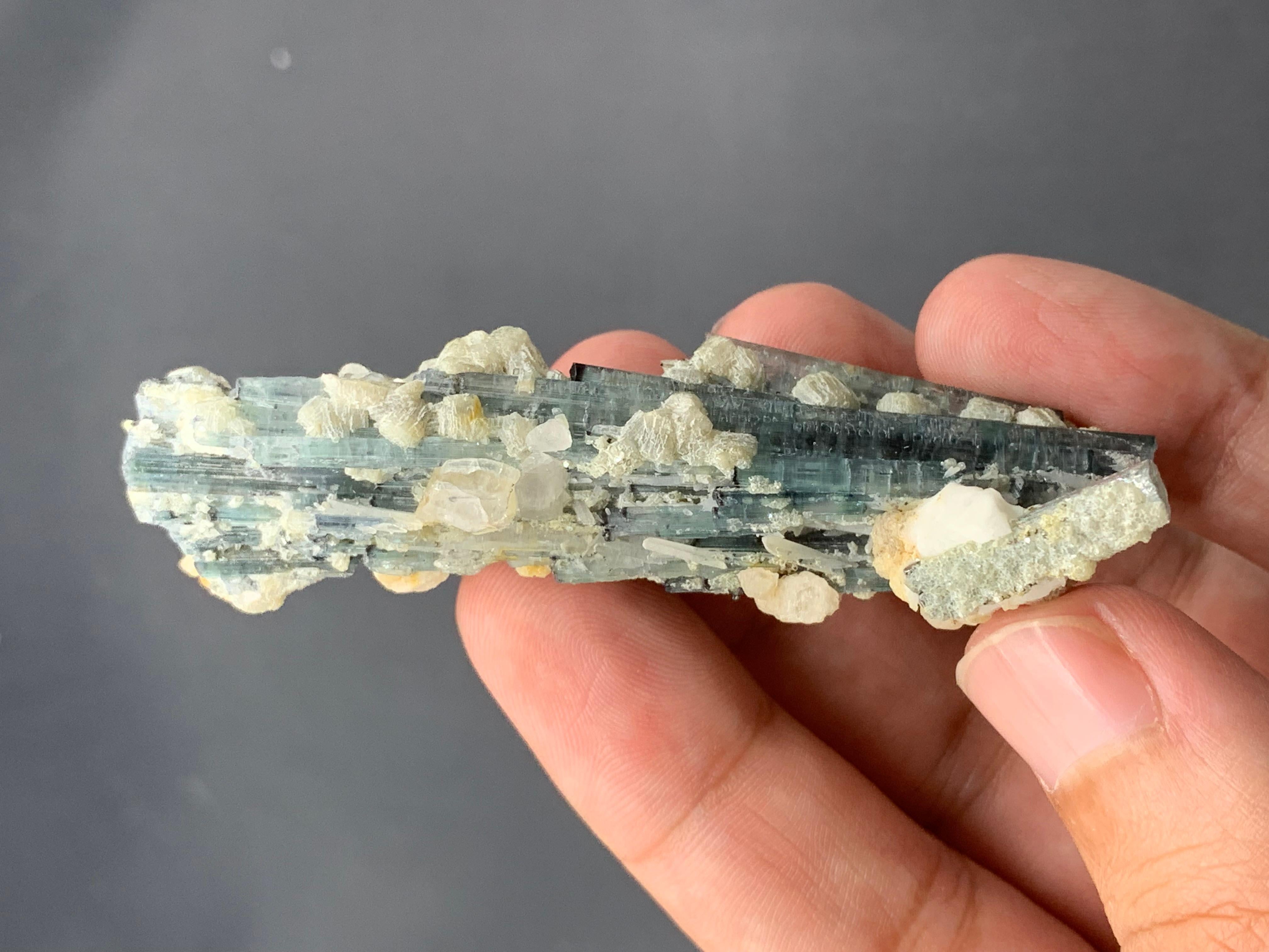 PRODUCT INFORMATION:

Natural Tourmaline Specimen 

Weight: 22.77 Grams

Dimension: 7.7 x 2.2 x 2.2 cm 

Locality: Kunar, Afghanistan 

Treatment: None

DESCRIPTION: 

This impressive natural tourmaline specimen, weighing 22.77 grams, hails from the