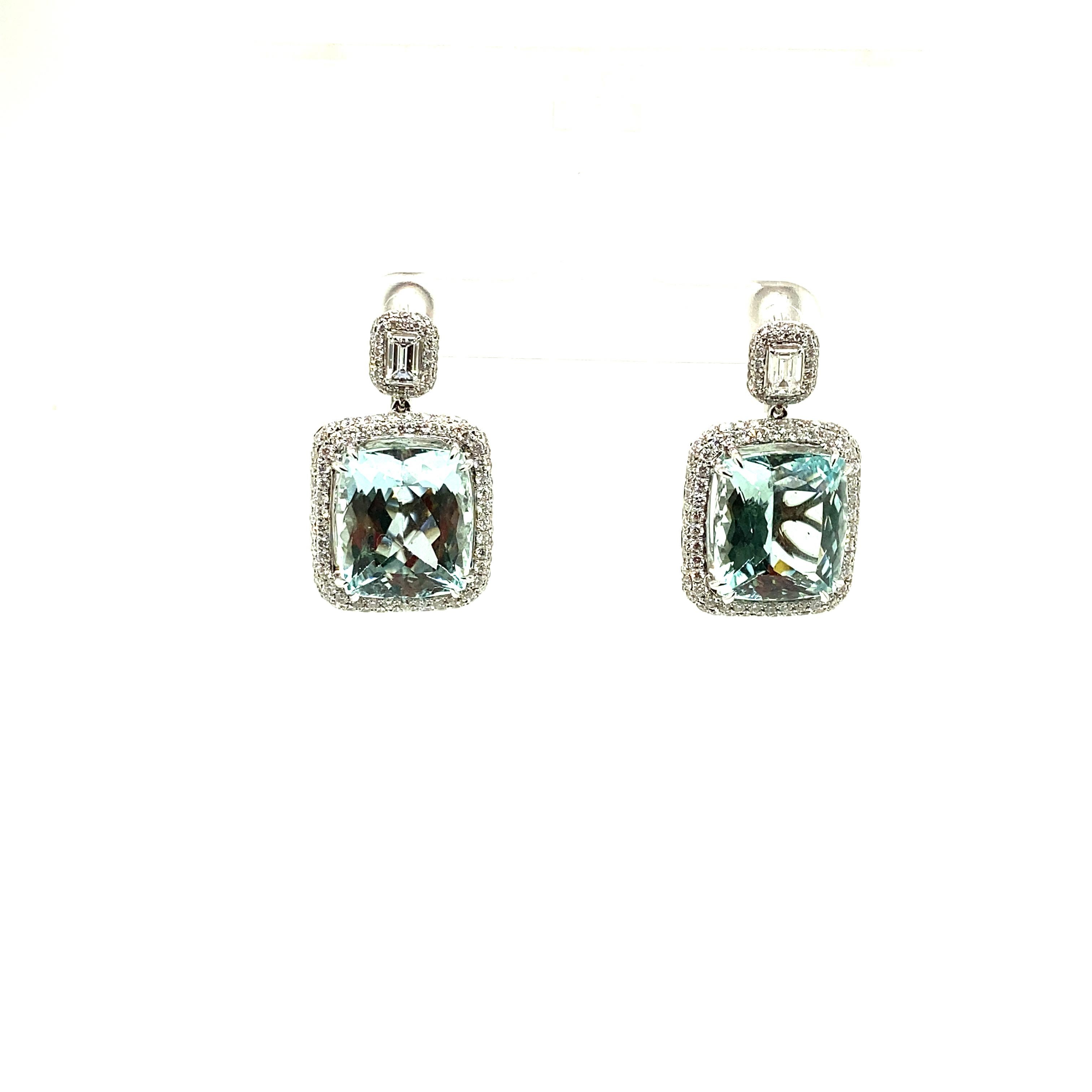 22.79 Carat Natural Cushion-Cut Aquamarine and White Diamond Gold Earrings:

A beautiful pair of earrings, it features 2 cushion-cut natural aquamarines weighing 22.79 carat surrounded and topped by white round brilliant-cut and emerald-cut diamonds