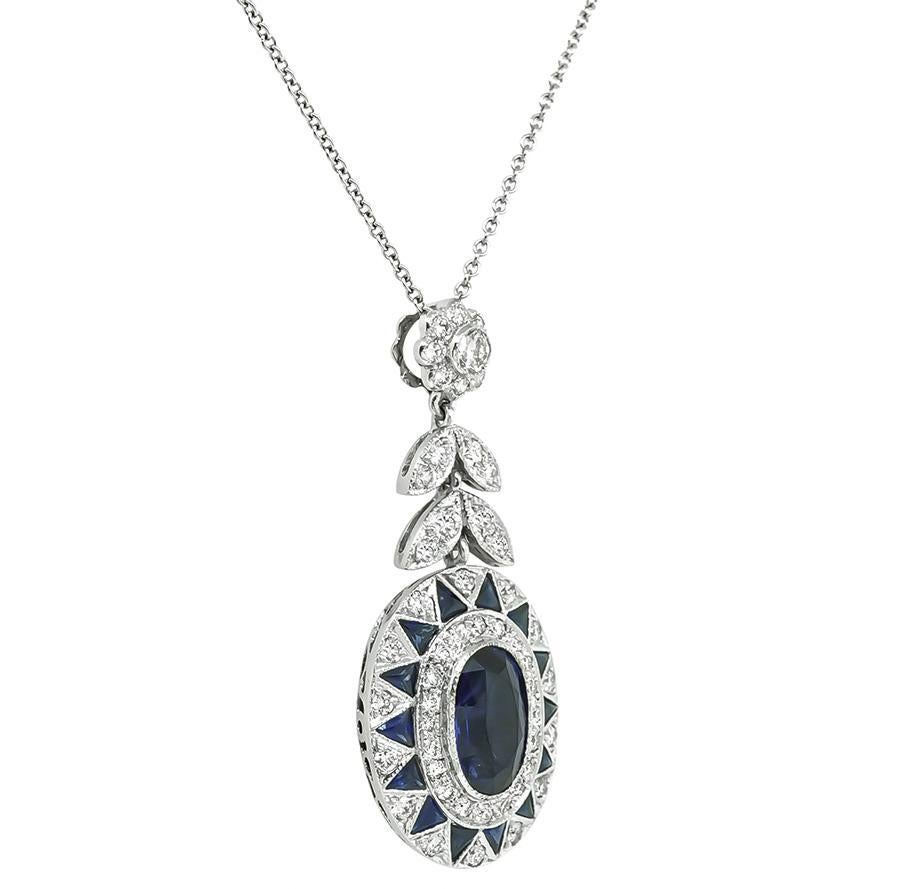 This is a fabulous 18k white gold pendant necklace. The pendant is set with lovely oval and trilliant cut sapphires that weigh approximately 2.27ct. The sapphires are accentuated by sparkling round cut diamonds that weigh approximately 0.95ct. The