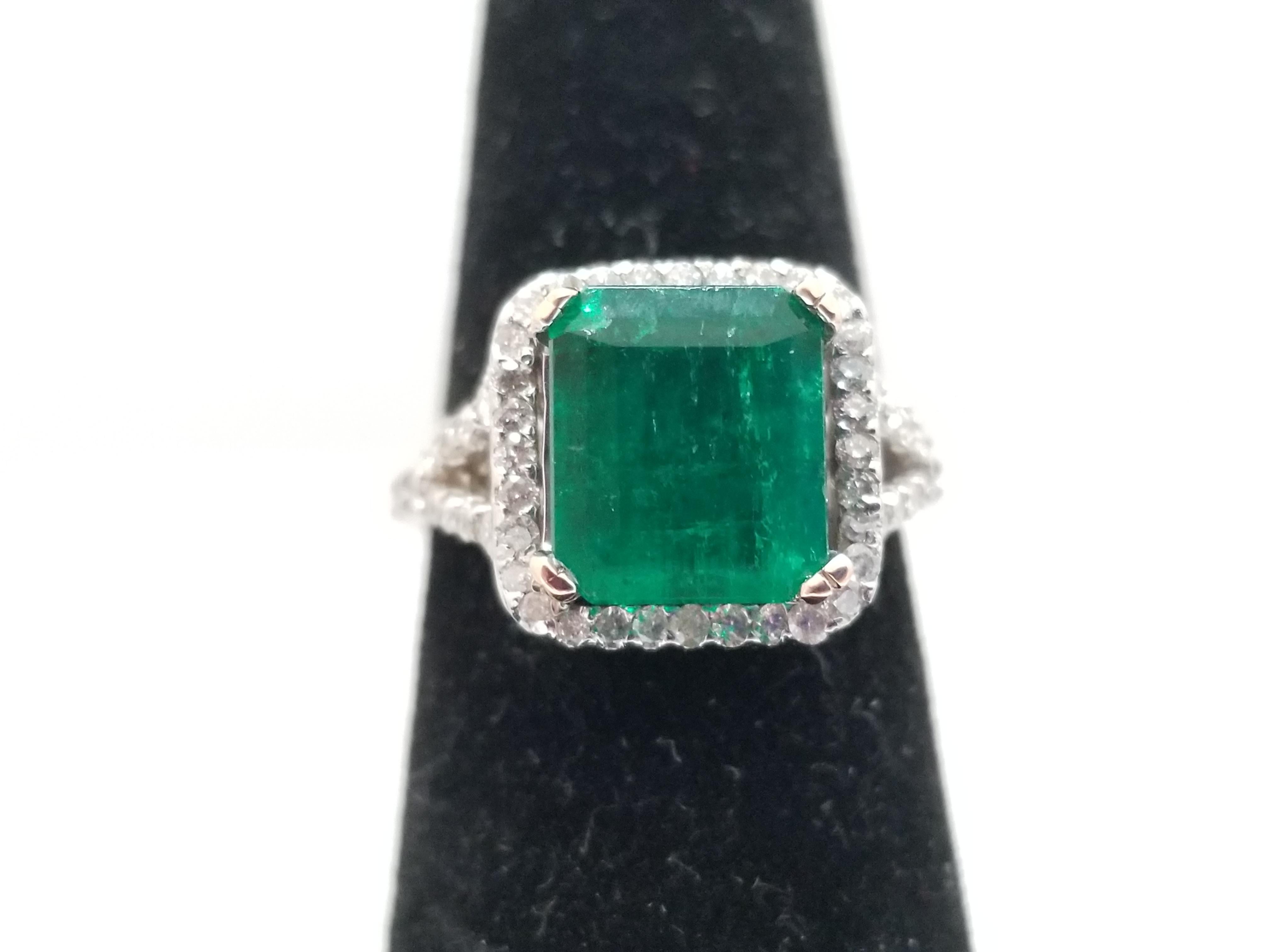 Beautiful 2.28 carats of Colombian Emerald, white diamond band total weight 0.78 carats. Set on 4 prong 14k white gold. Ring Size 6.5. Exquisite style for every day.
