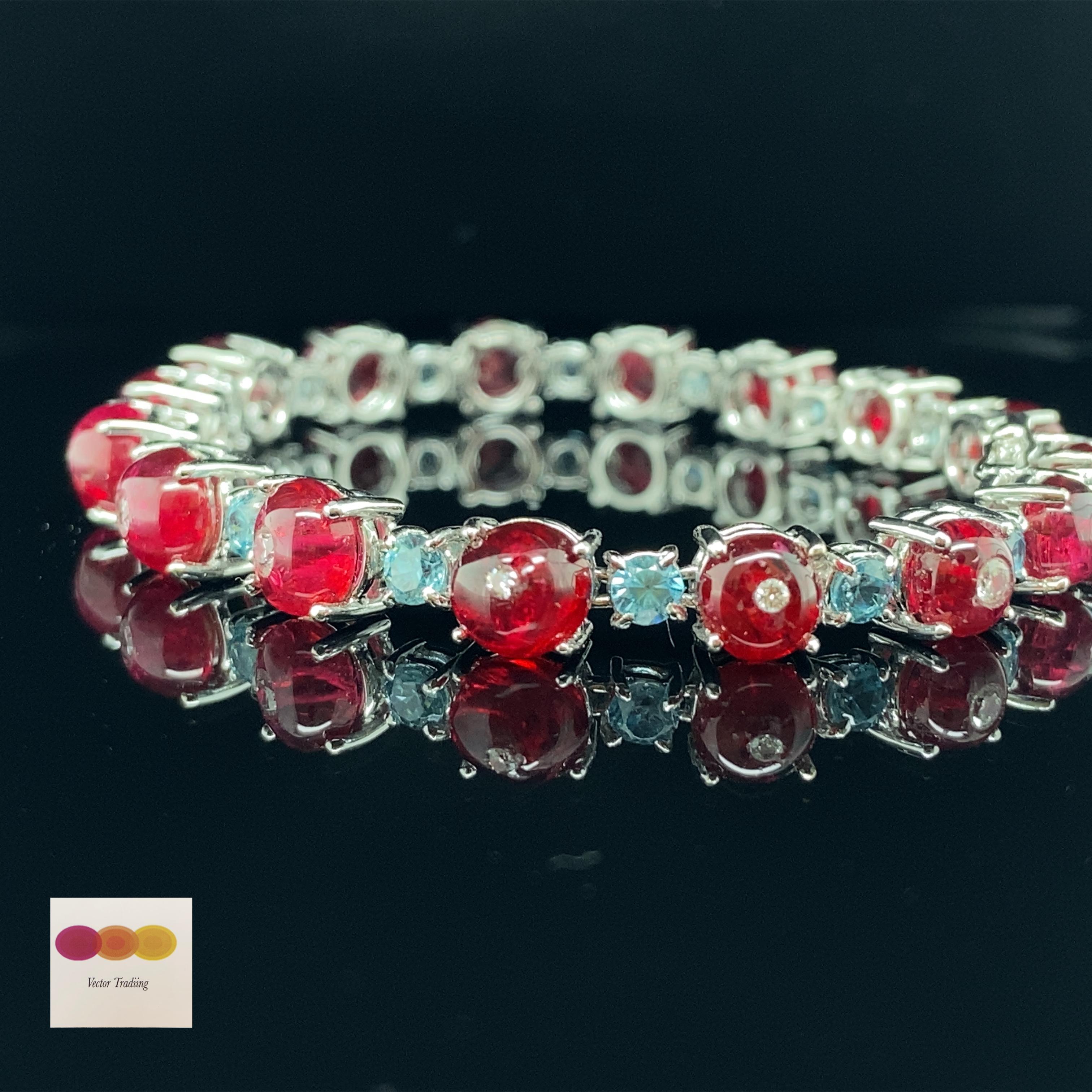 22.8 Carat Natural Burma No Heat Spinel Beads Blue Zircon White Diamond Bracelet:

A beautiful jewel, it features natural Burmese unheated red spinel beads weighing 22.8 carat inlayed with white diamonds weighing 0.96 carat and interspersed with