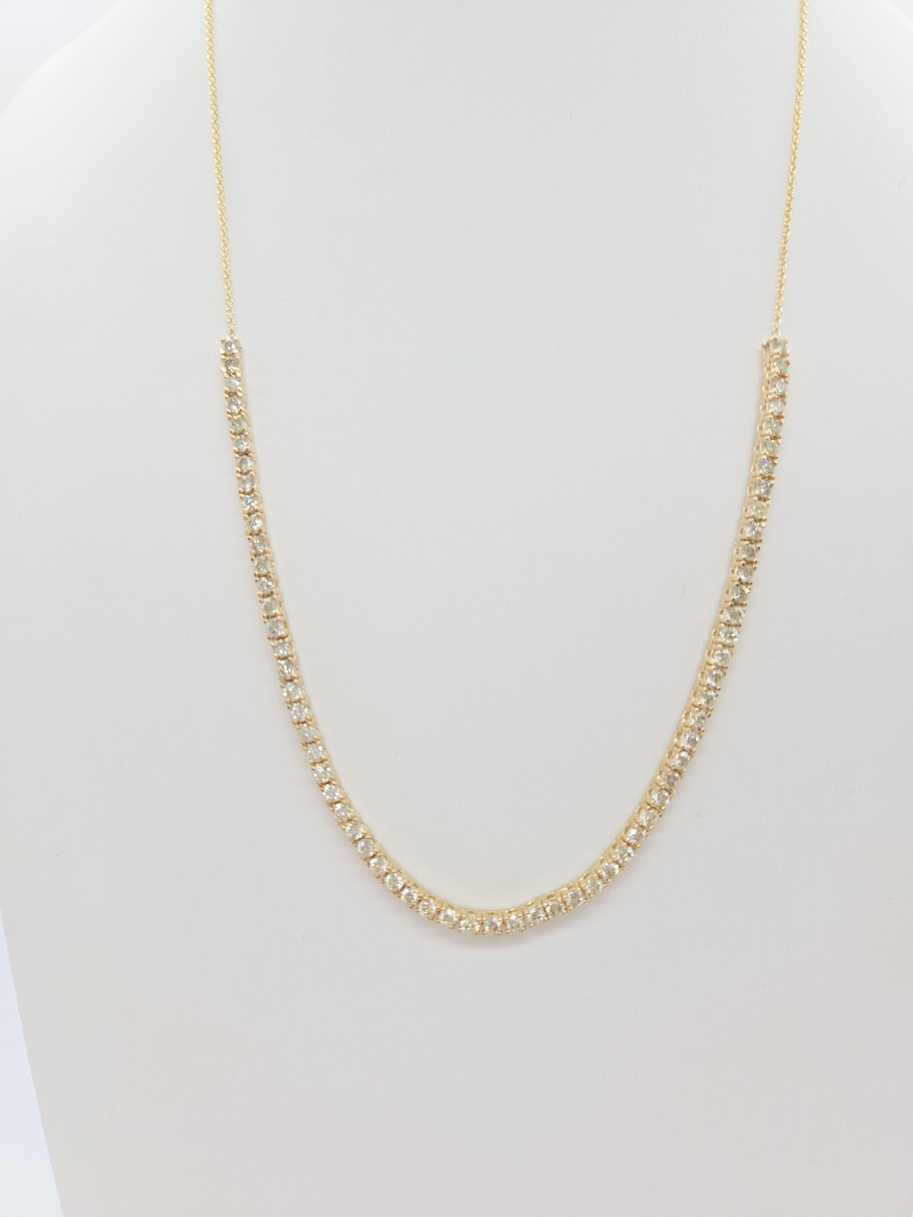 Elevate your elegance with this timeless 2.28 carat mini necklace, featuring natural round-brilliant cut white diamonds set in a stunning tennis setting. Crafted in 14K yellow gold, the four-prong design maximizes light reflection for an exceptional