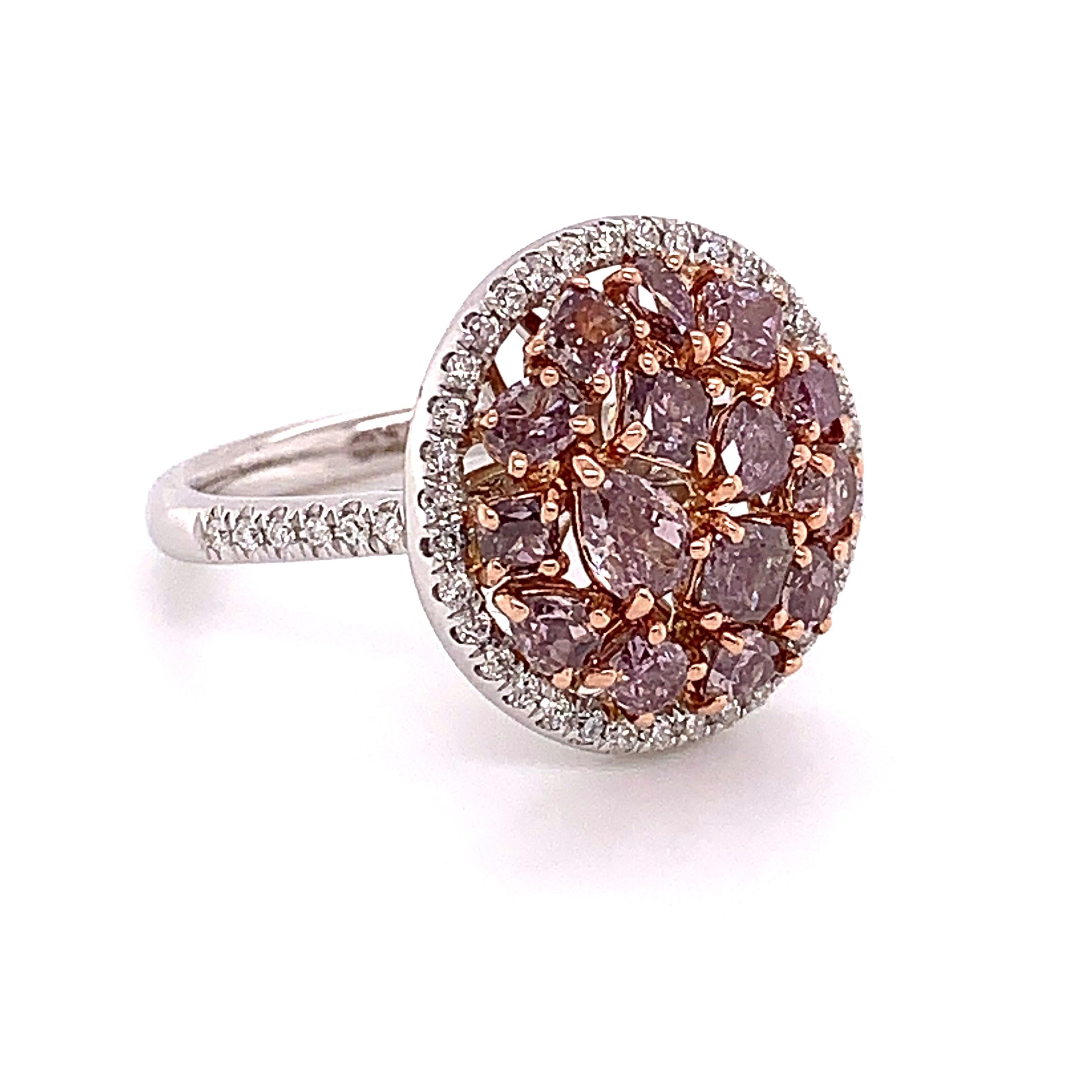 Exquisite Natural Pink Diamond Cluster Ring. This ring features a Cluster Center of Mixed Cut Natural Fancy Pink Diamonds surrounded by a dainty but powerful Halo of White Diamonds. 
Total Carat Weight: 2.28 Carat
Natural Fancy Pink Diamonds:1.97