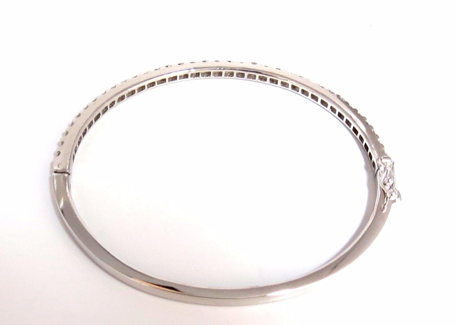 2.28ct natural diamonds bangle bracelet

beautiful sharing / common prong

Rounds & Full cut.

G-color & Vs-2 clarity.

14kt. white gold 

12 Grams.

3mm wide

7 inch (wearable length)

Secure Lock, safety catch and snap (button mechanism)

$9,000