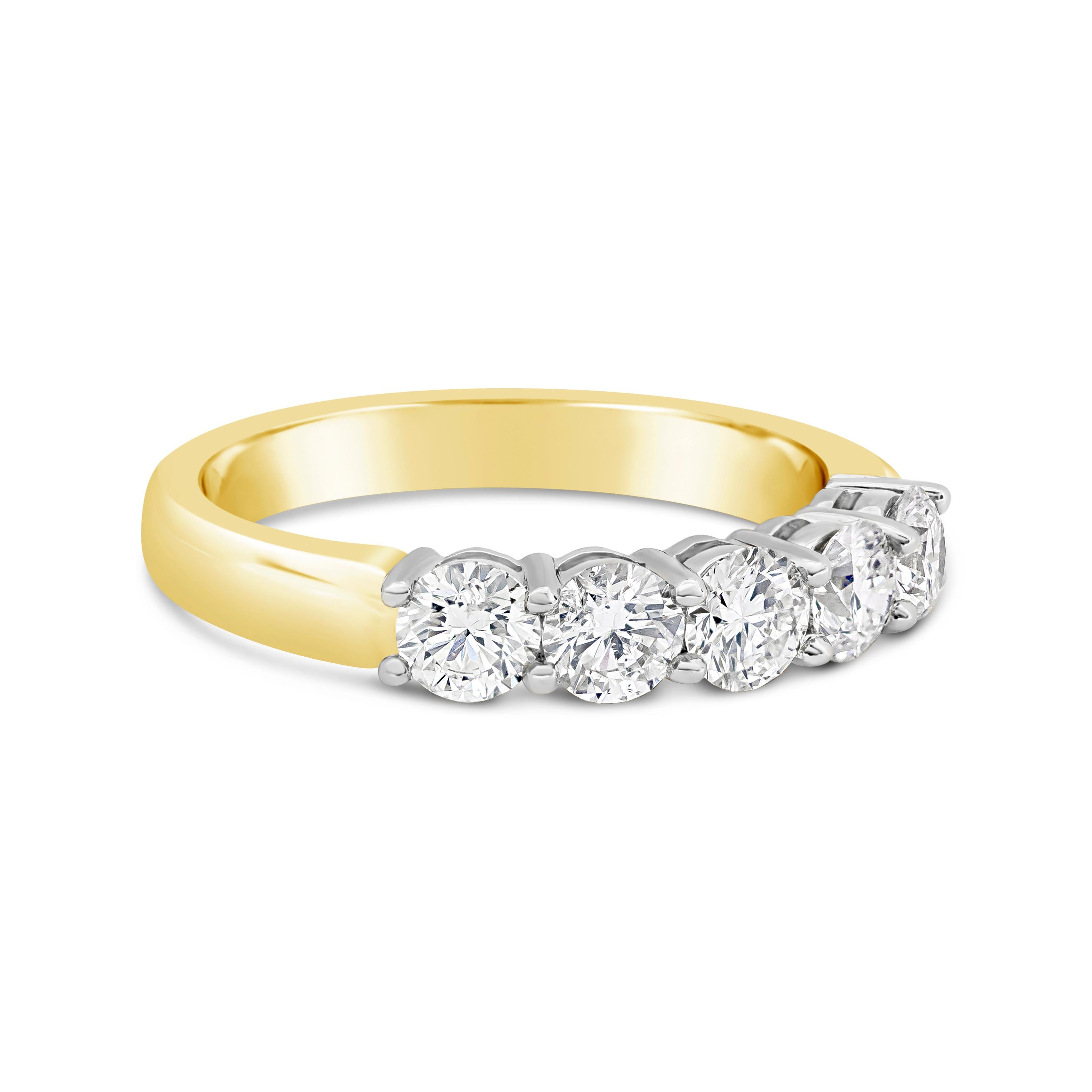 A design that surpasses time because of its simplicity and brilliance. Five sparkling diamonds weighing 2.28 carats total securely sit in shared prongs made in platinum. Polished yellow gold composition with angular edges for a sleek and comfortable