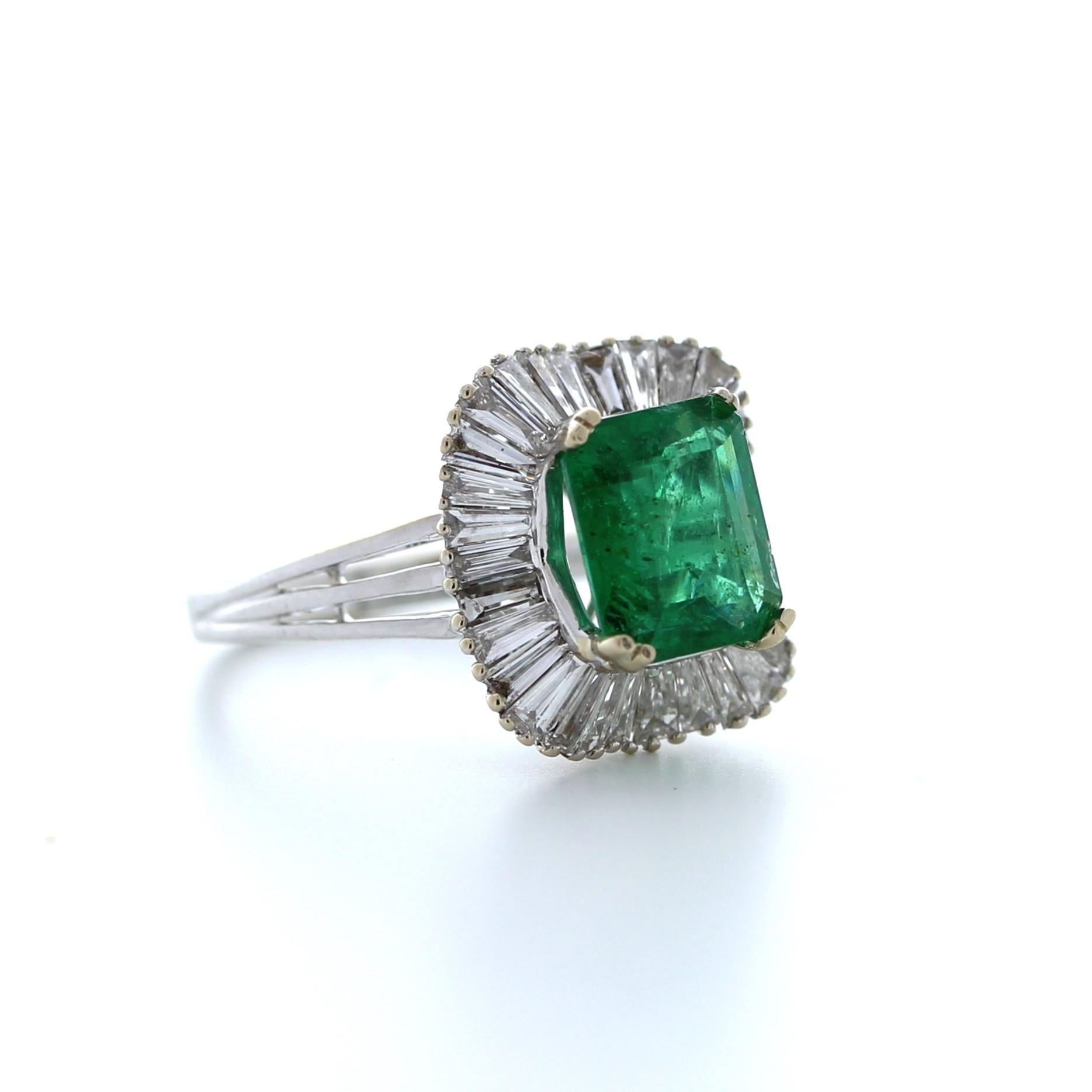 This stunning 2.28 carat weight green emerald fashion ring is a truly breathtaking piece of jewelry. The emerald is a brilliant shade of green and boasts exceptional clarity and brilliance, weighing in at 2.28 carats. It is set in luxurious 18K