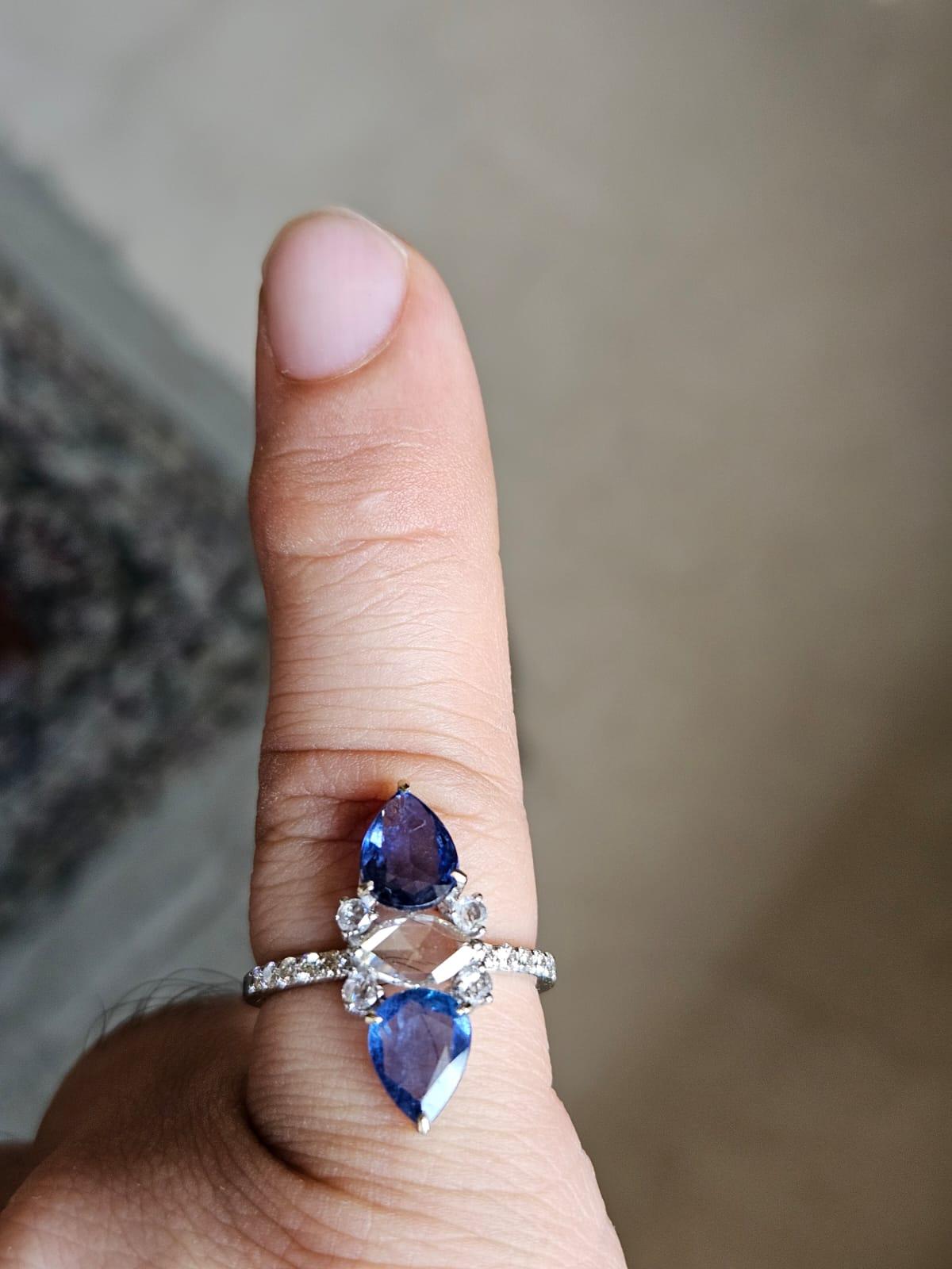 A very gorgeous and beautiful, Blue Sapphire & Diamonds Cocktail Ring set in 18K White Gold & Diamonds. The weight of the Blue Sapphires is 2.28 carats. The Blue Sapphires are of Ceylon (Sri Lankan) origin. The combined Diamonds weight is 0.59