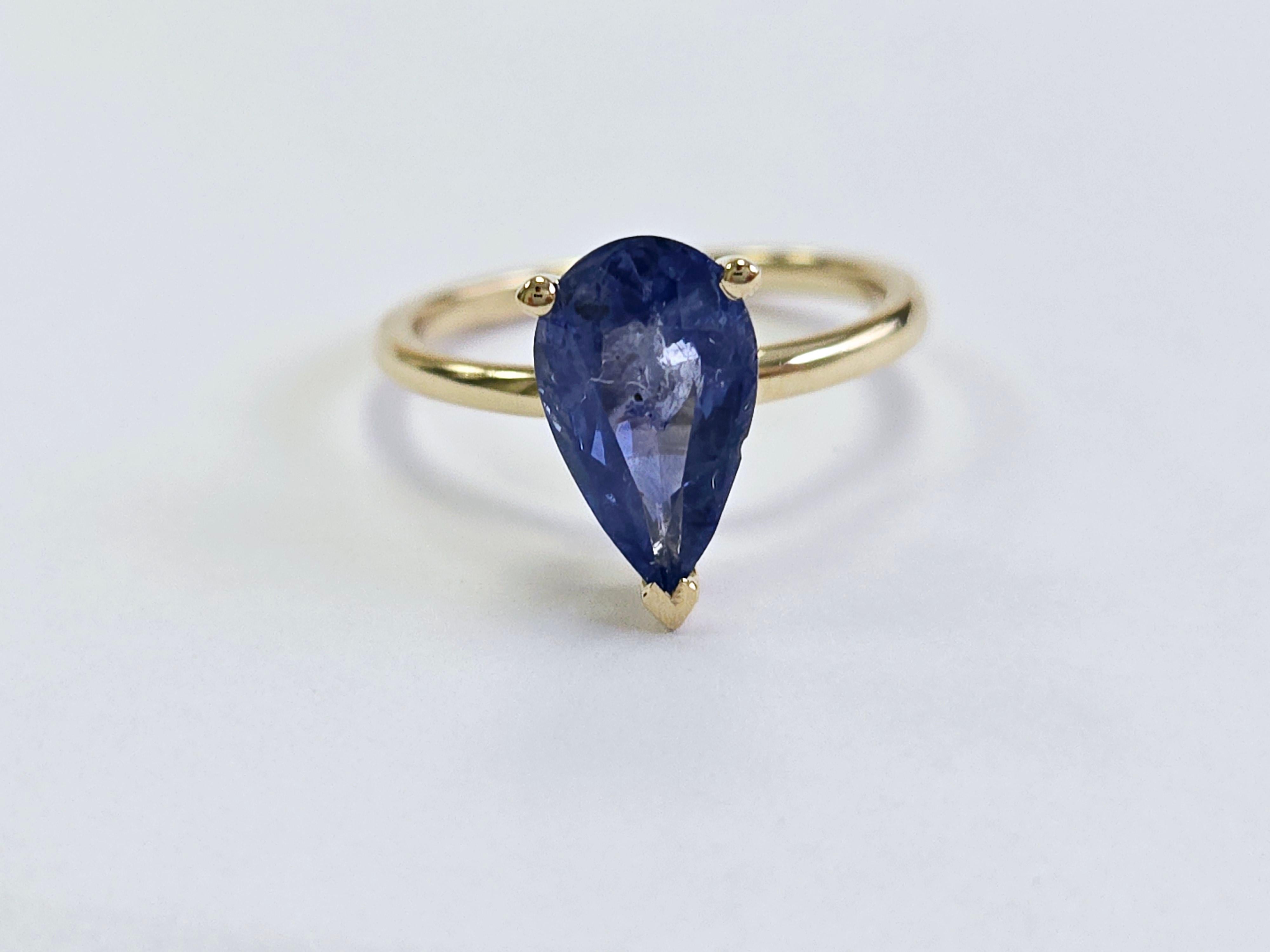 2.28 Carat Pear Natural Sapphire Ring in 14 Karat Yellow Gold

This exquisite ring features a brilliant 2.28-carat natural sapphire, cut into a perfect pear shape, set in a luxurious 14-karat yellow gold band. The sapphire's rich color and