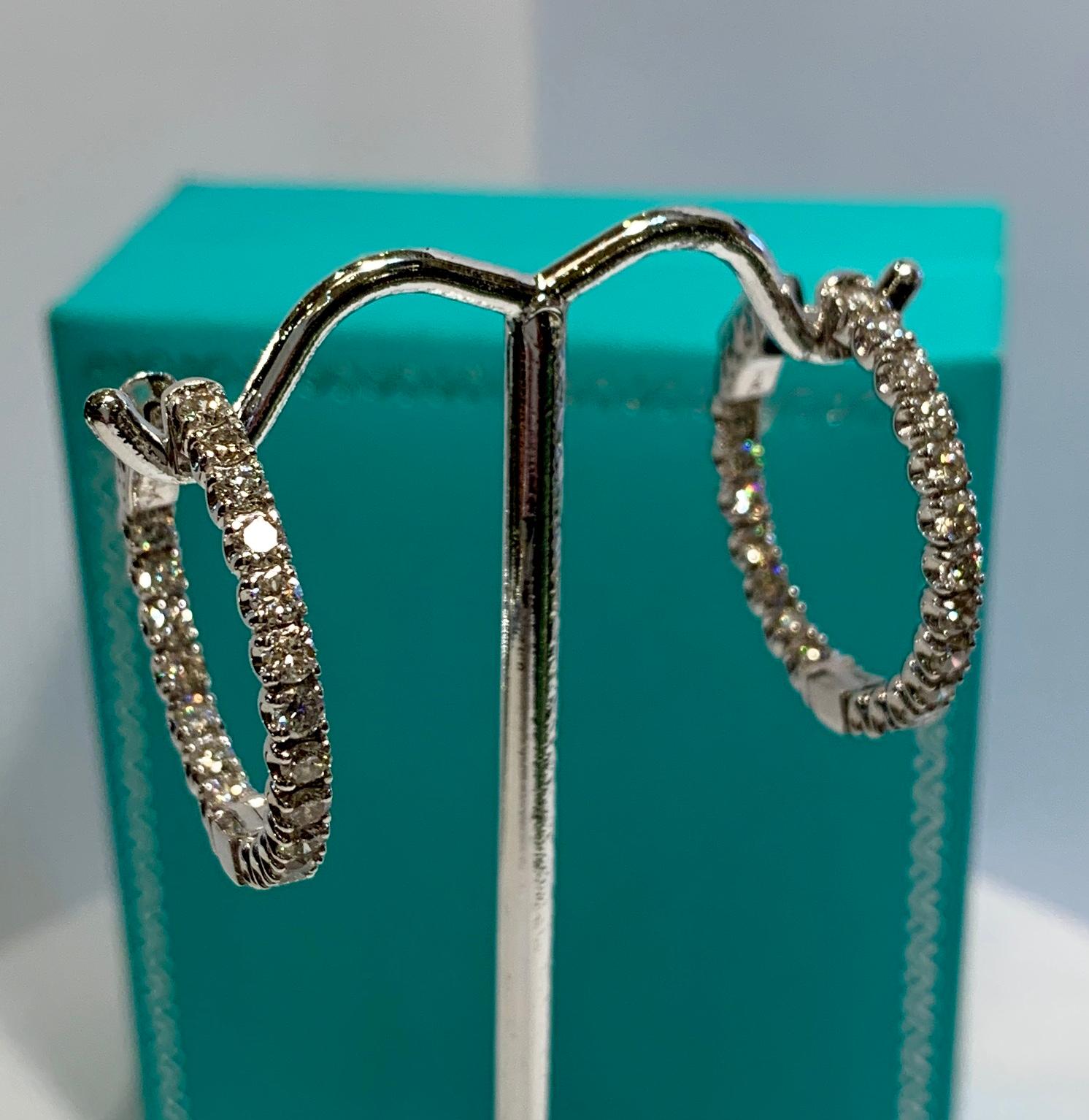 The epitome of understated elegance, these earrings feature 38 sparking round brilliant white diamonds “U” set in 14 karat white gold, with all the diamonds facing forward.  So wearable they will become your favorite pair, these sparkling diamond