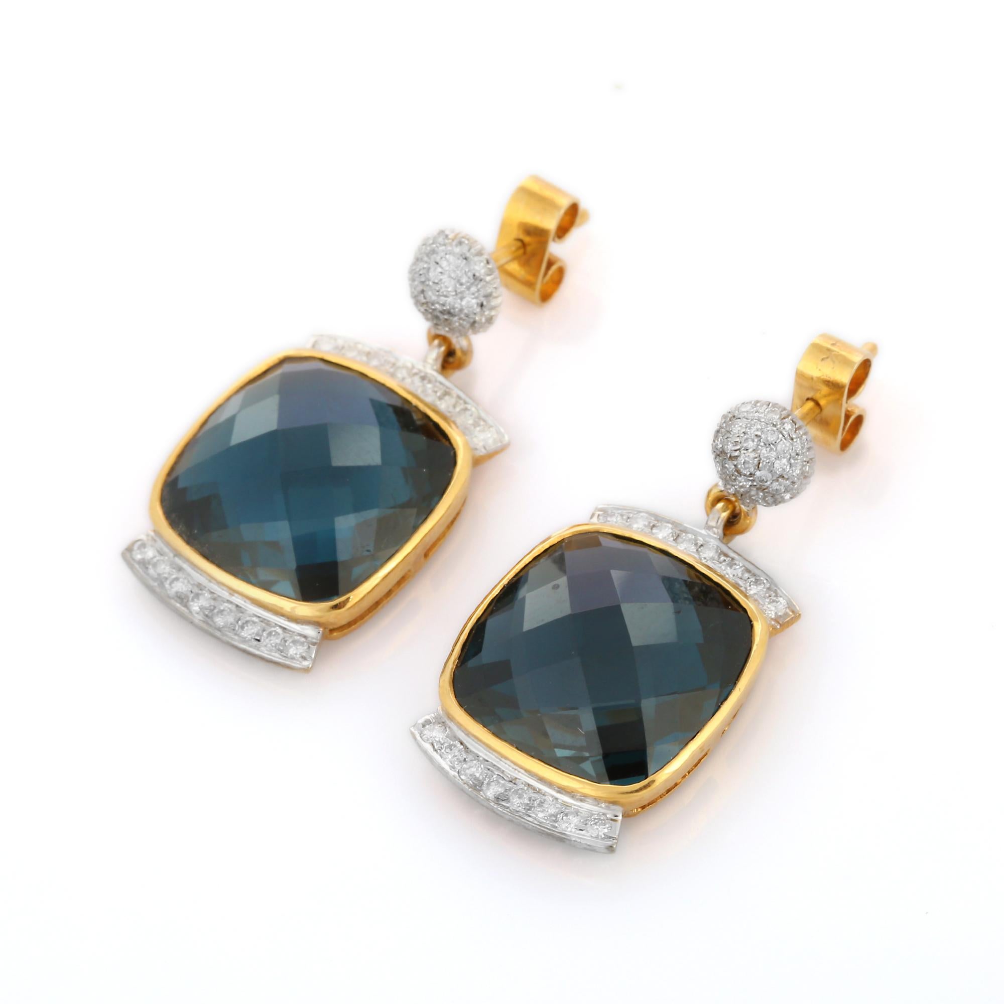 Blue Topaz and Diamond Dangle earrings to make a statement with your look. These earrings create a sparkling, luxurious look featuring cushion cut gemstone.
If you love to gravitate towards unique styles, this piece of jewelry is perfect for
