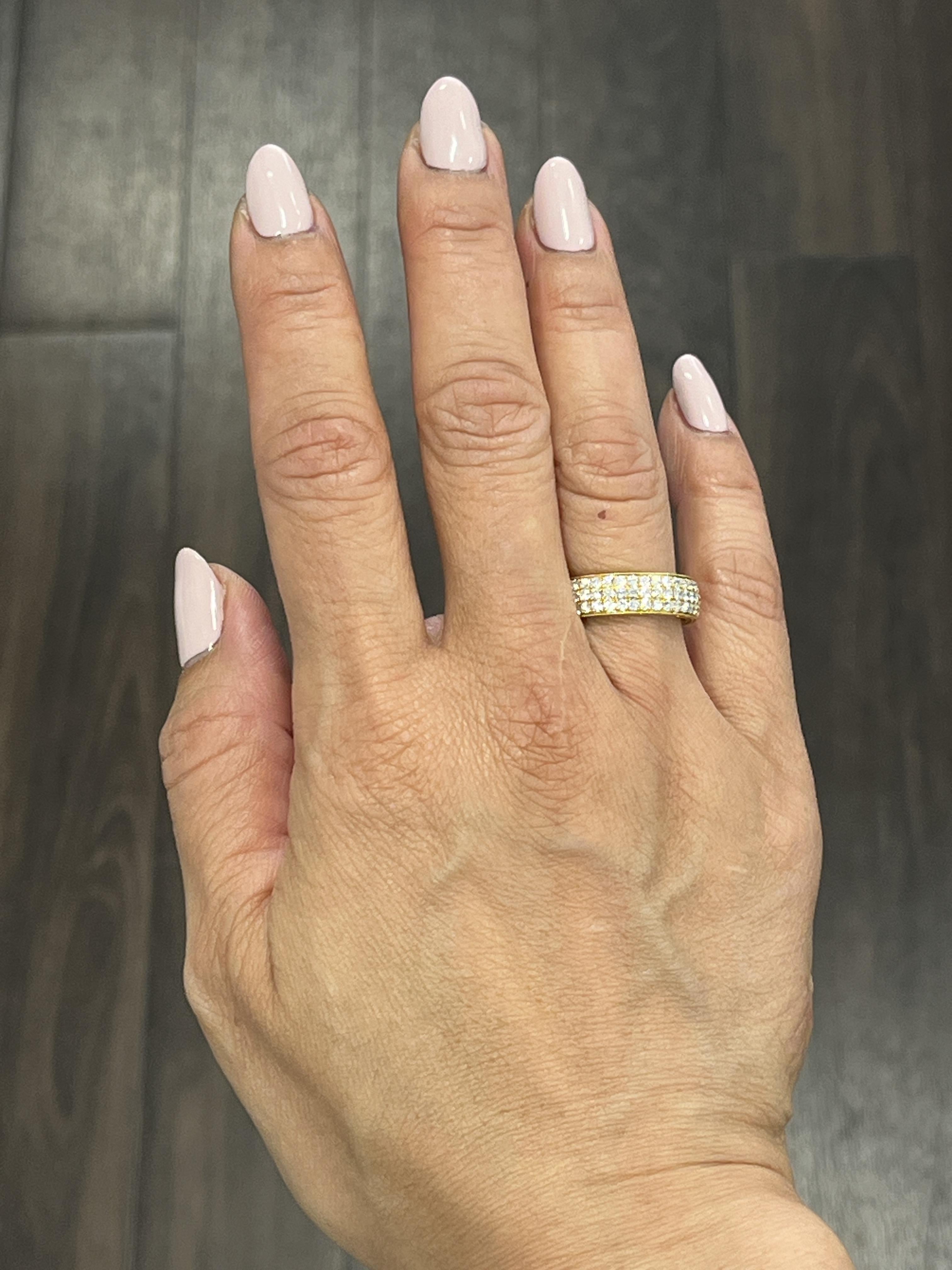 Check out this beautiful yellow gold diamond eternity band. This eternity band features 114 diamonds weighing 2.28 ct set in 18k yellow gold. The diamonds are F/G in color and VS1 in clarity. A gorgeous ring to wear everyday, or for a special