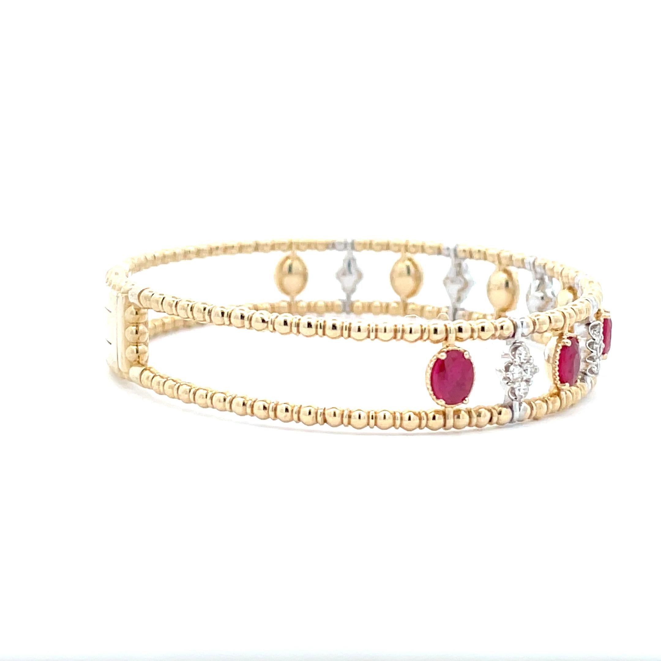 The ultimate celebration of life, our 2.28 ct. Ruby and Diamond Gold Bead Cage Bangle is the perfect gift for any occasion. Crafted by a professional artisan, this bold bangle was designed with premium metals and sparkling cut stones that capture