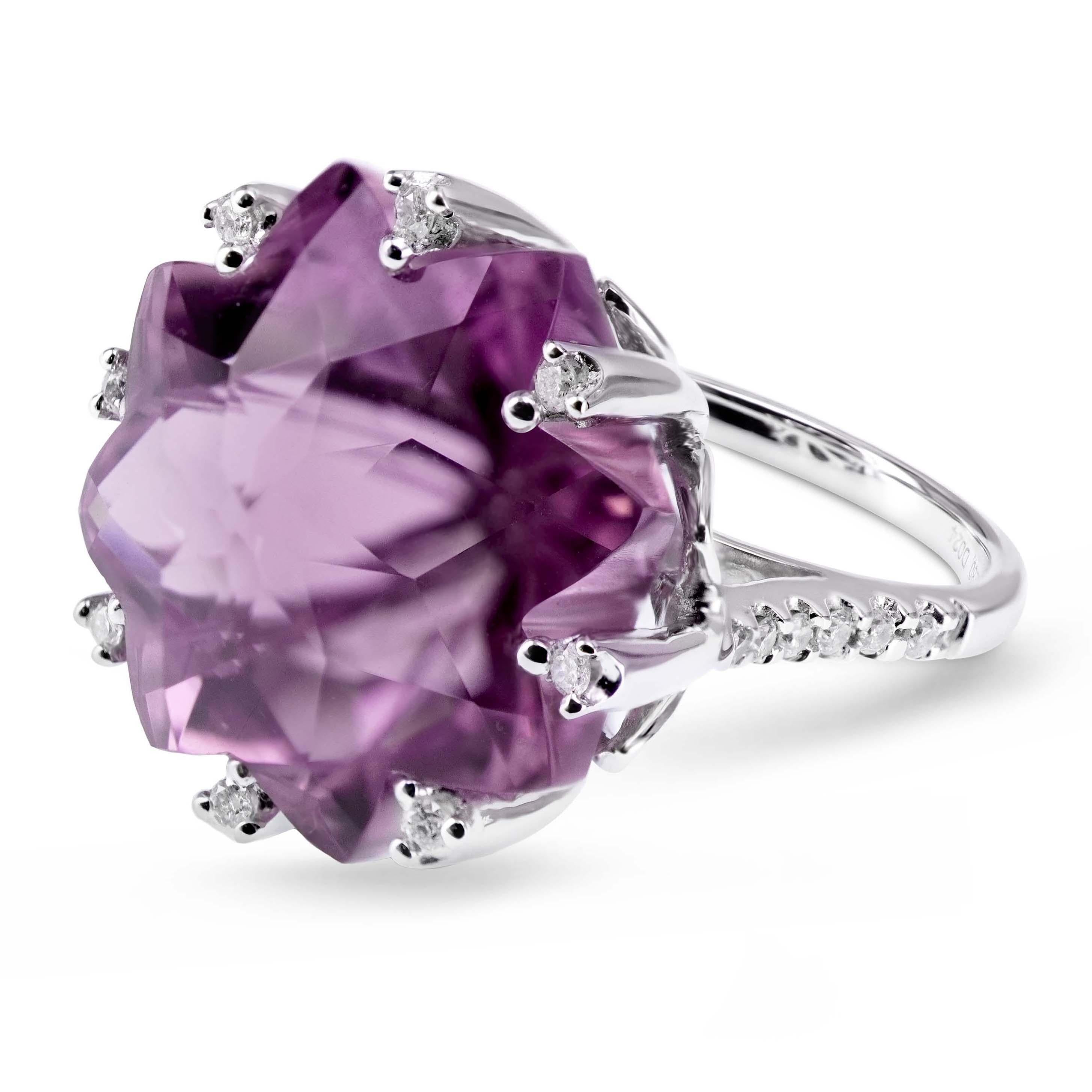 An exquisite 22.80 carat of flower cut Amethyst is set along with 0.24 carat of white brilliant round diamond. Amethyst is the most popular variety of quartz crystals that is considered the most powerful and protective stone. It is a semiprecious