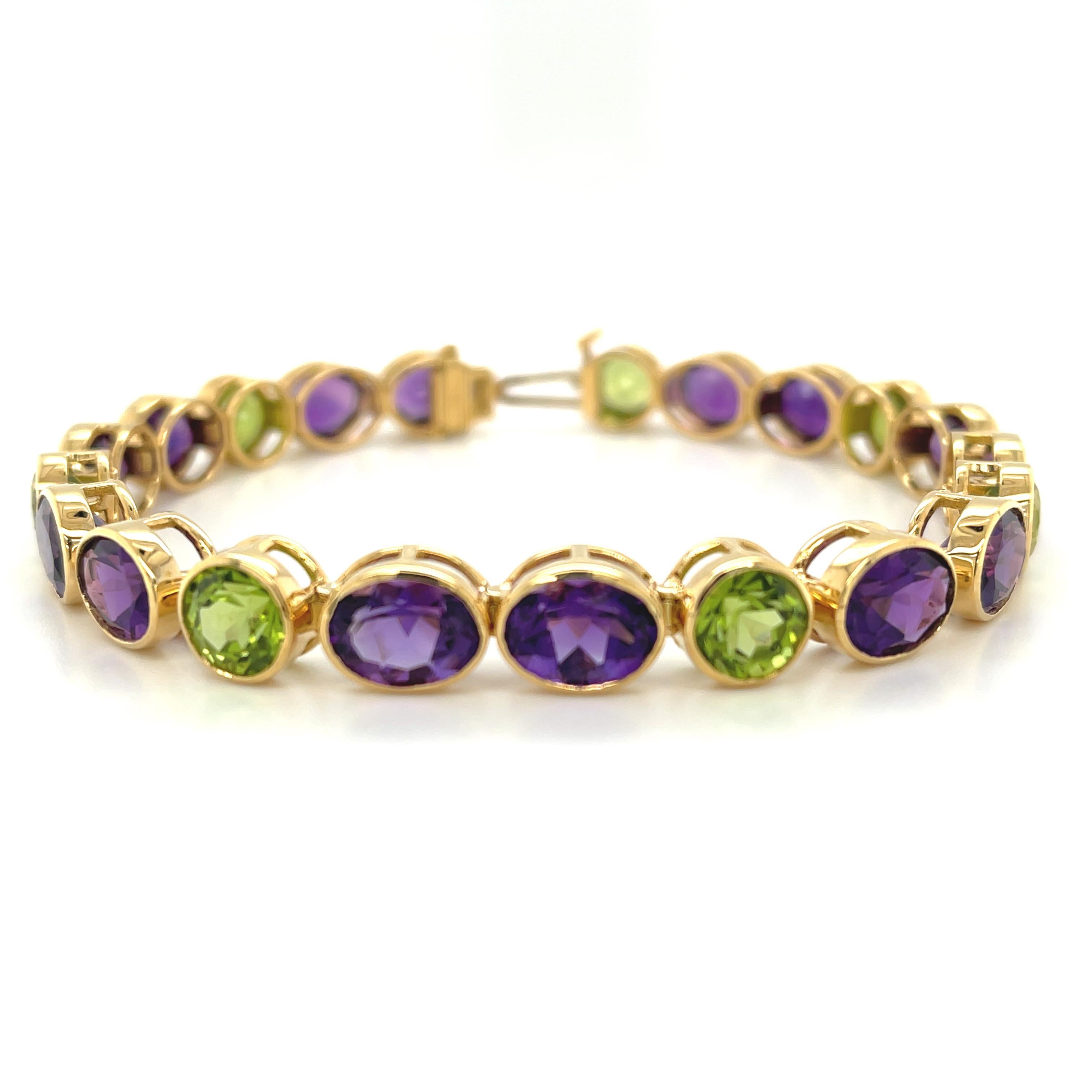 This beautiful 18k yellow gold bracelet is smart, chic, and contains a truly impressive collection of bright and colorful gems! Top quality royal purple amethysts are paired with bright and brilliant gem peridots in an unusual, complementary color