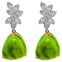 Orecchini in oro giallo e bianco con diamante rotondo e peridoto da 22,85 carati