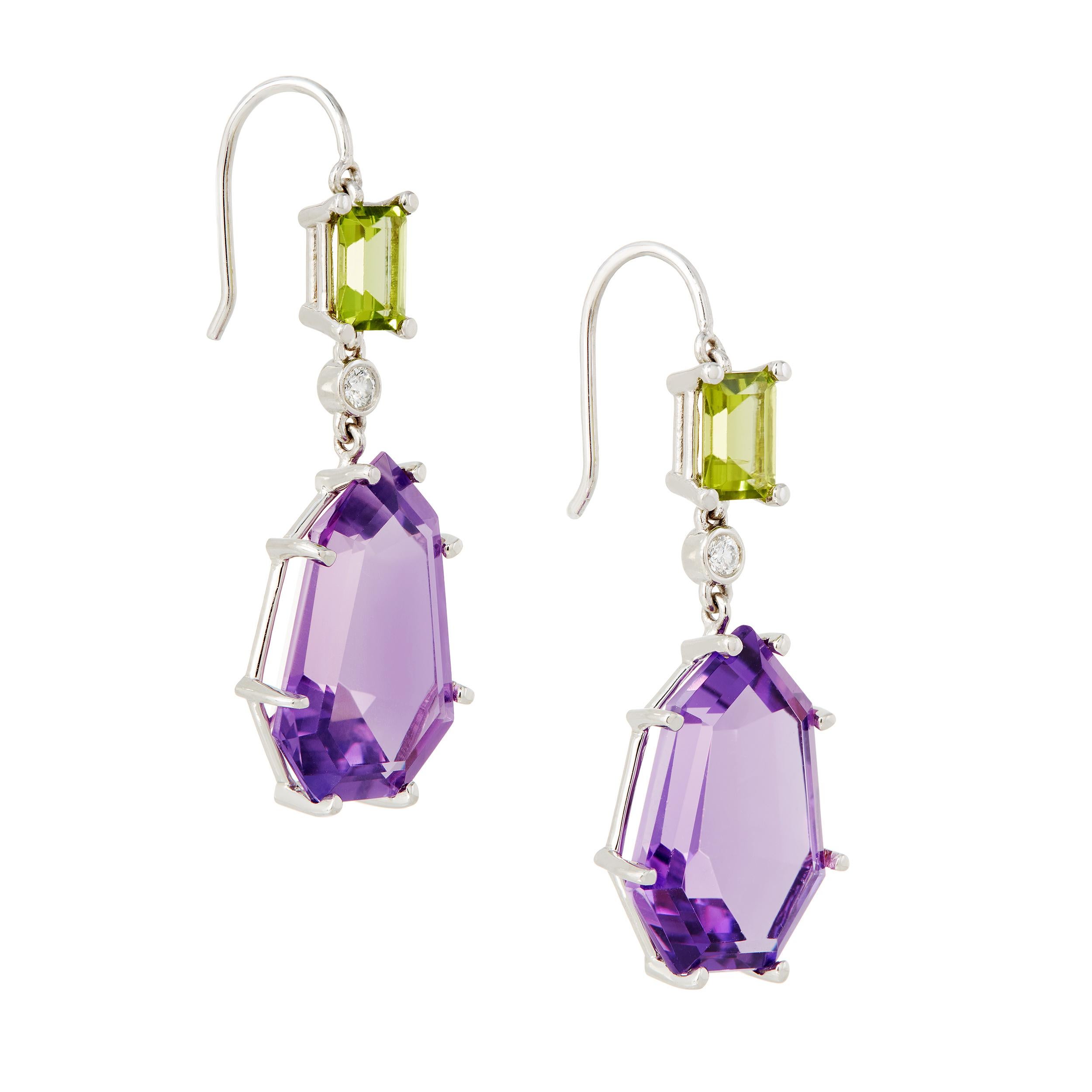 When discovered, Amethyst was believed to be the tears of Dionysus, the god of wine and revery.  Perfect for these fun earrings! This a custom fancy shape of Amethyst making this one of a kind design all the more unique.

Gemstone Details
    