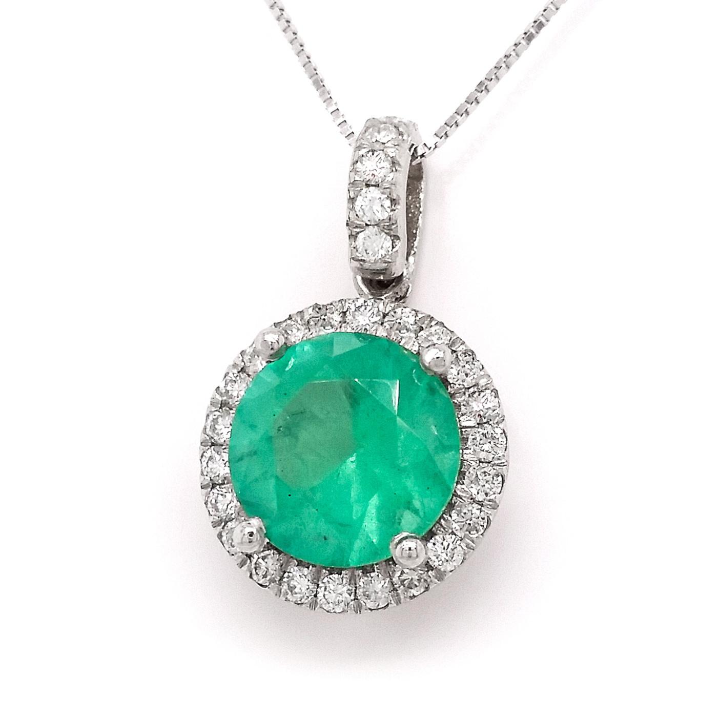 FOR U.S. BUYERS NO VAT 

This amazing 14kt white gold pendant featuring a gorgeous emerald 2.00 carats with INDICATION OF MINOR CLARITY surrounded by 27 round brilliant  diamonds. This beautiful color combination will immediately win your heart.