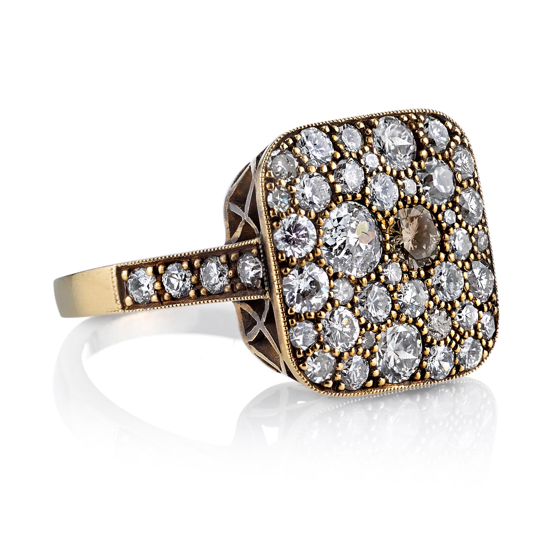 Approximately 2.30ctw varying old cut and round brilliant cut diamonds in a handcrafted 18K oxidized yellow gold mounting. 

Ring is currently size 6. Please contact us about potential re-sizing.

Prices may vary according to total diamond weight