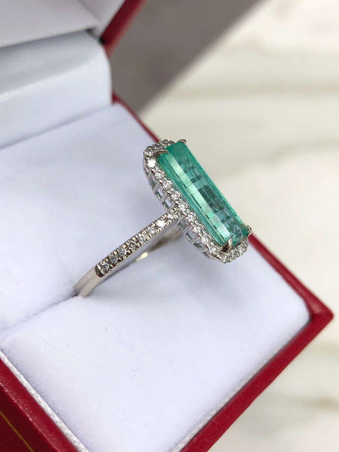 elongated emerald cut engagement ring