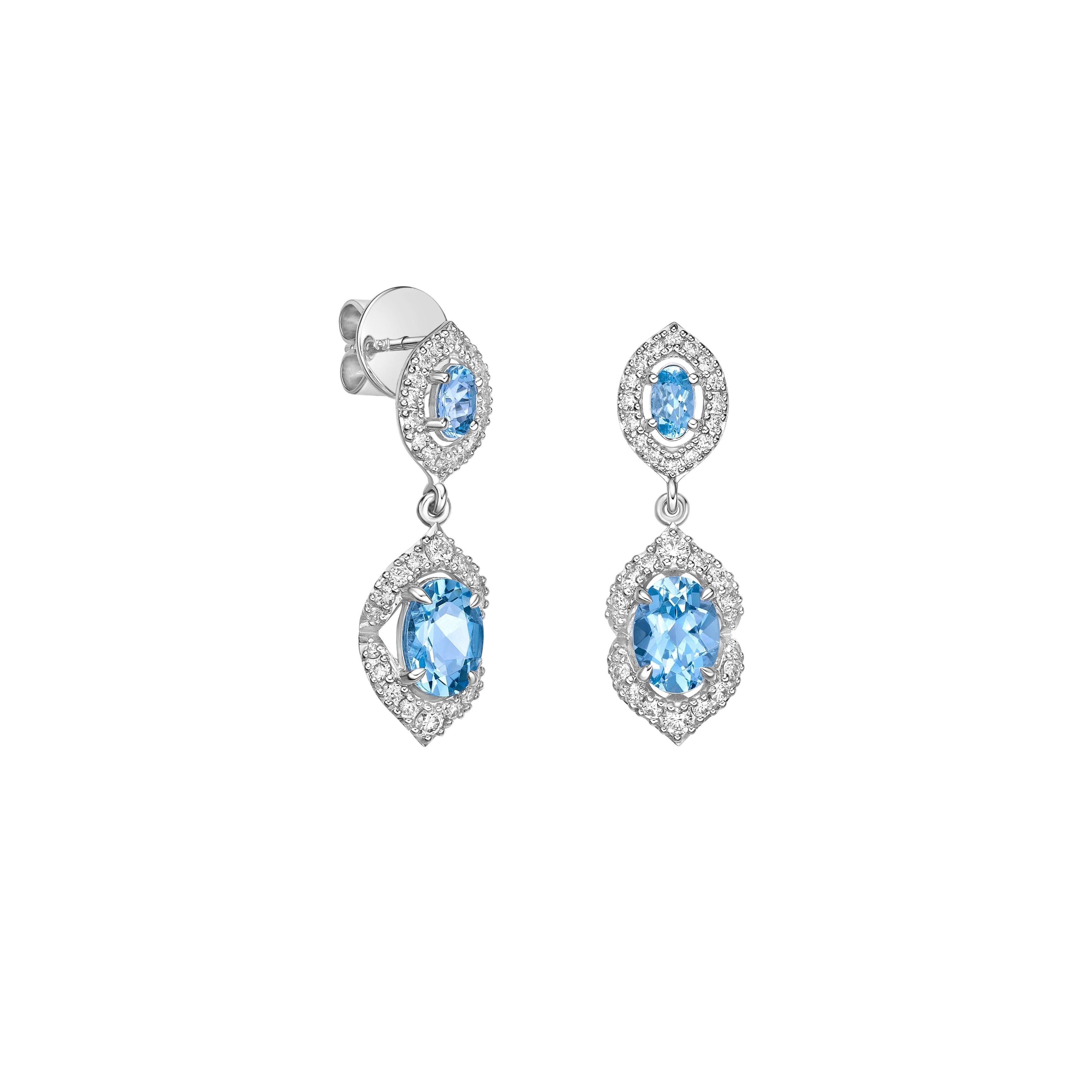 Elevate your look with our stunning aquamarine drop earrings, featuring a mesmerizing ice blue hue that radiates elegance. Enhanced with diamonds and crafted in white gold, these earrings offer a timeless allure with a touch of modern